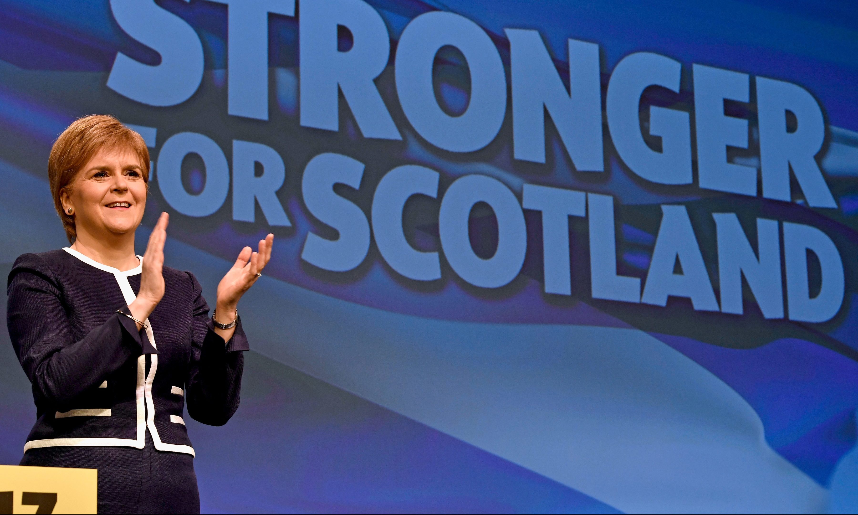 Nicola Sturgeon on stage on the first day of the SNP conference.