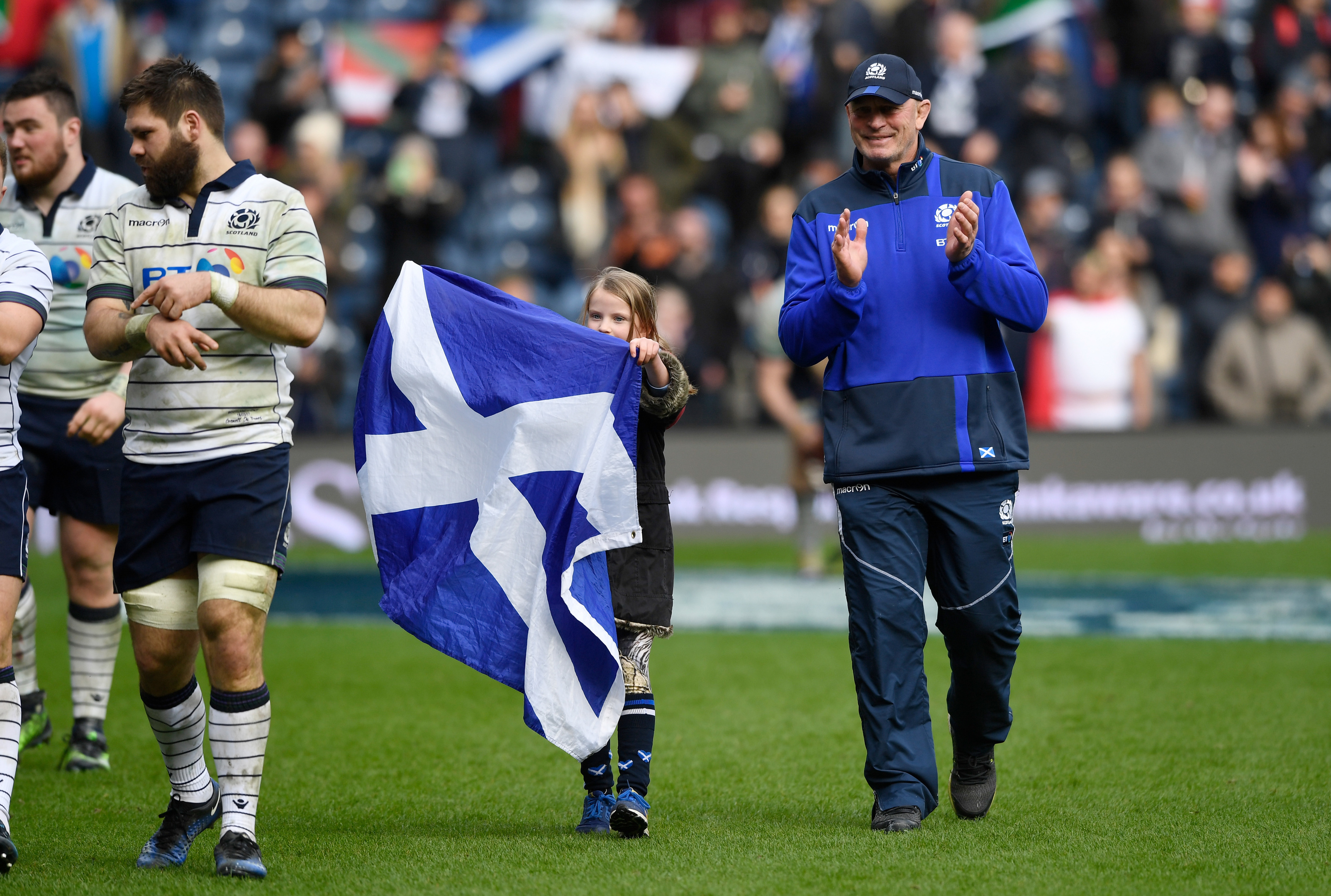Outgoing head coach Vern Cotter and daughter Arabella (8) enjoy the applause of Scotland fans after the win over Italy.