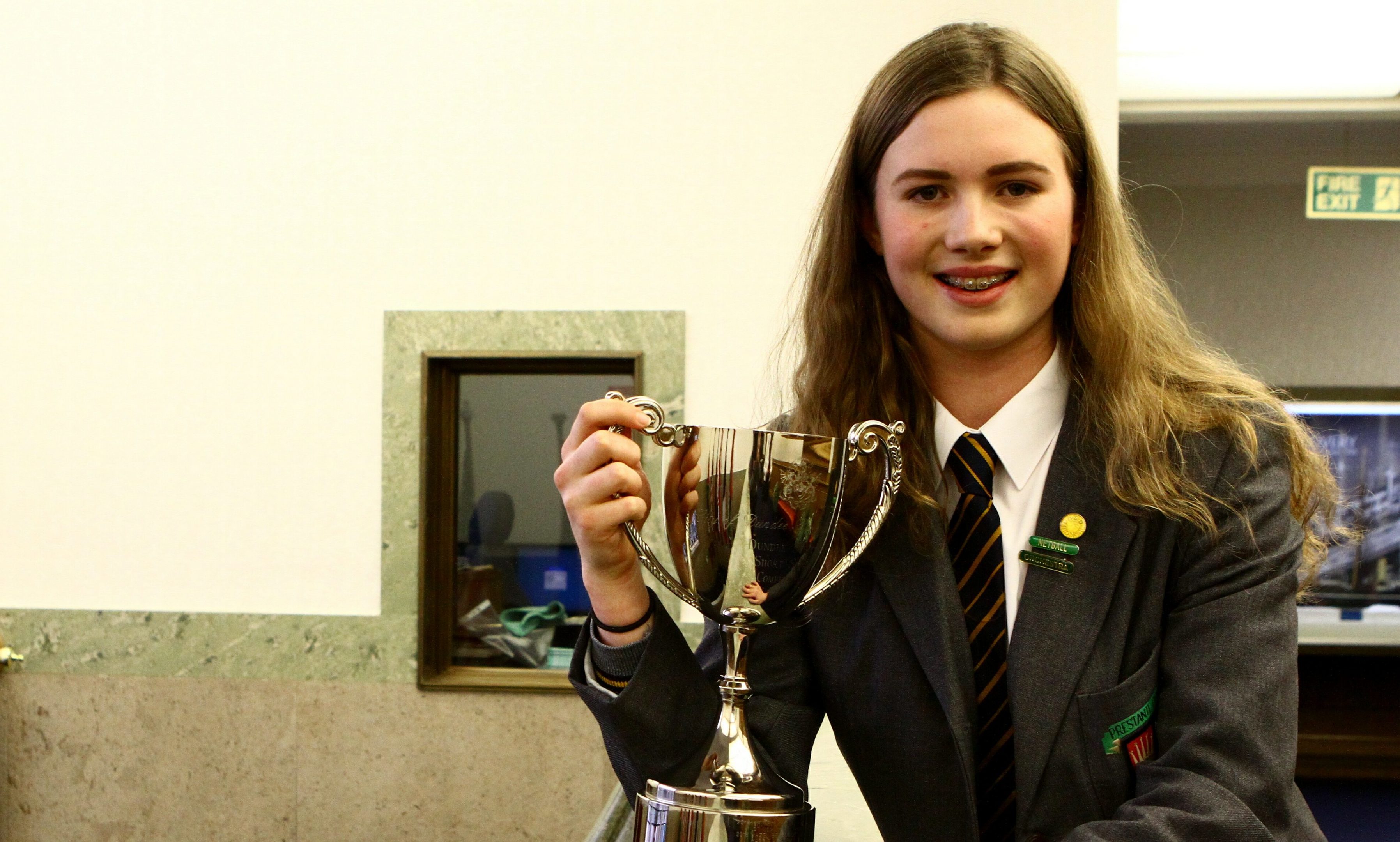 Winner of the Burgess Short Story Competition, Emily Baxter from Dundee High School, with her trophy at the City Chambers in Dundee.