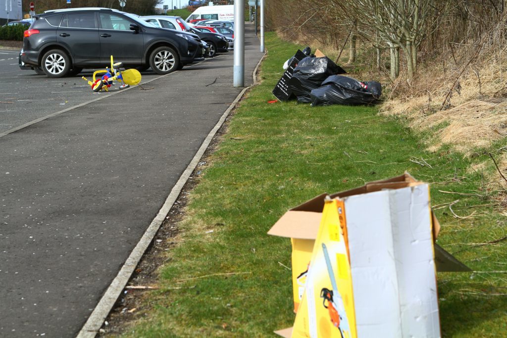 Bags of rubbish littered the site.