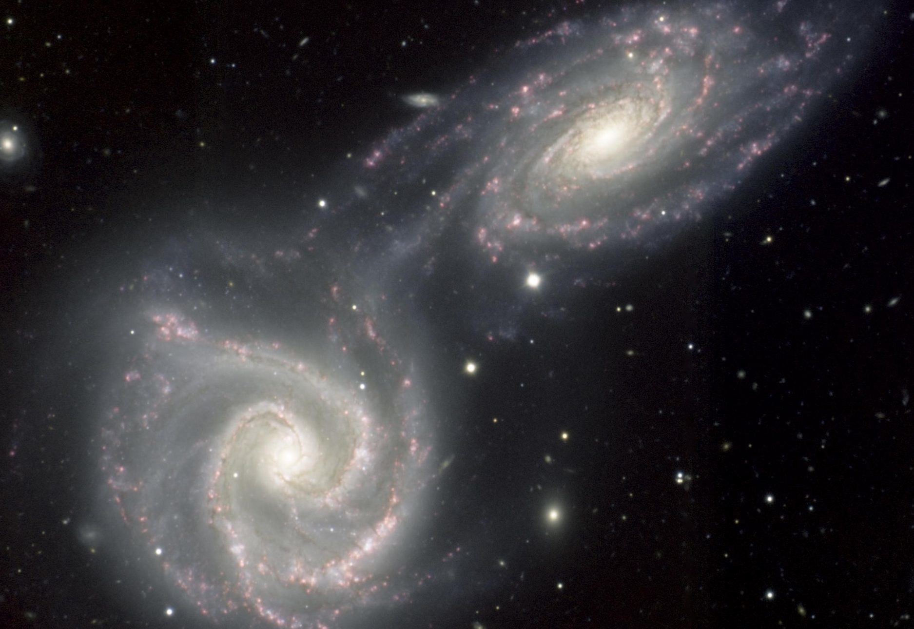 A present-day near-miss of two spiral galaxies NGC 5426 and NGC 5427, which may be comparable to the early flyby of the Andromeda Galaxy past our own.