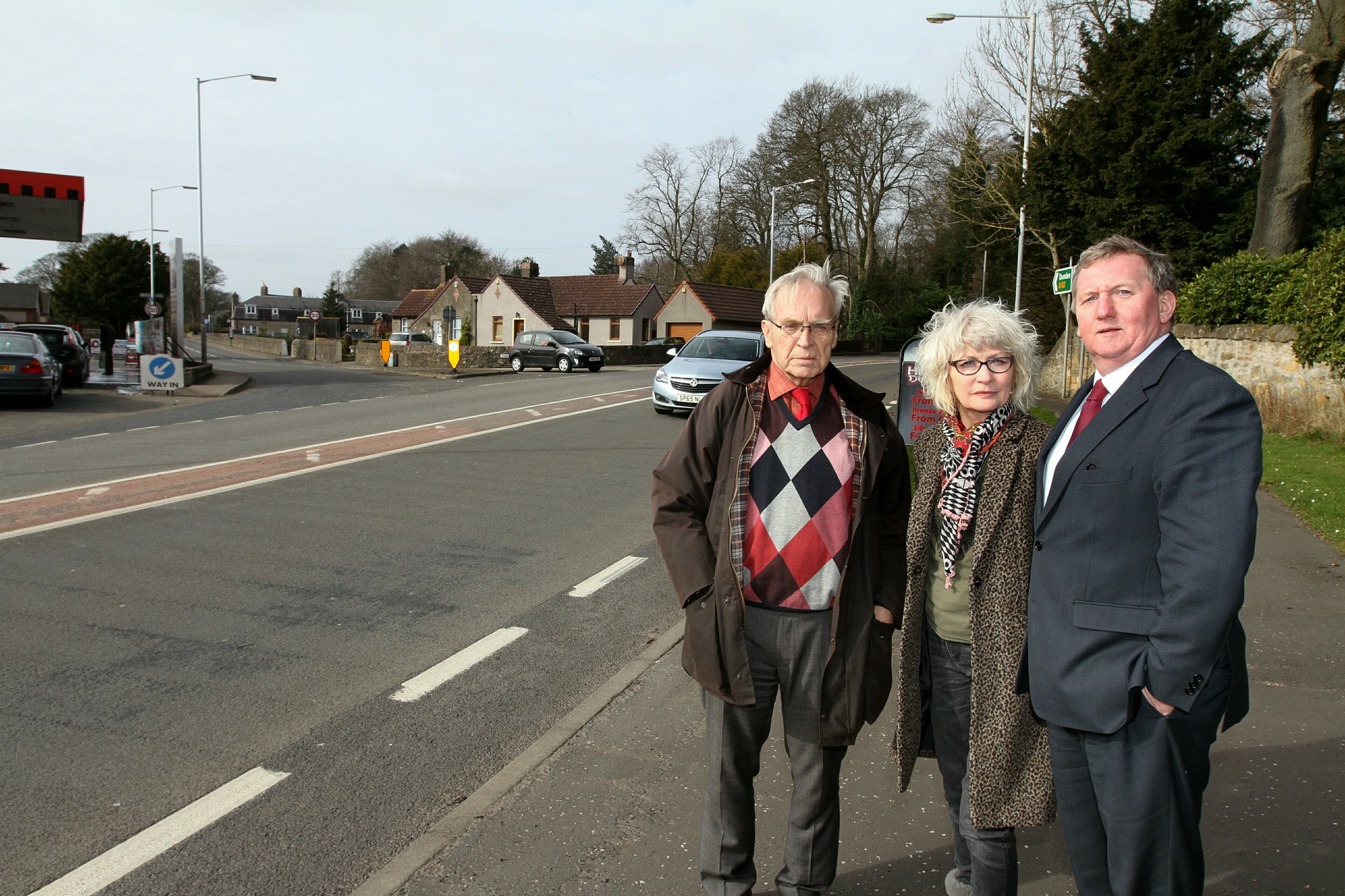 Ron Page, chairperson of North Glenrothes Community Council, with councillor Kay Morrison and MSP Alex Rowley at the Cadham junction.