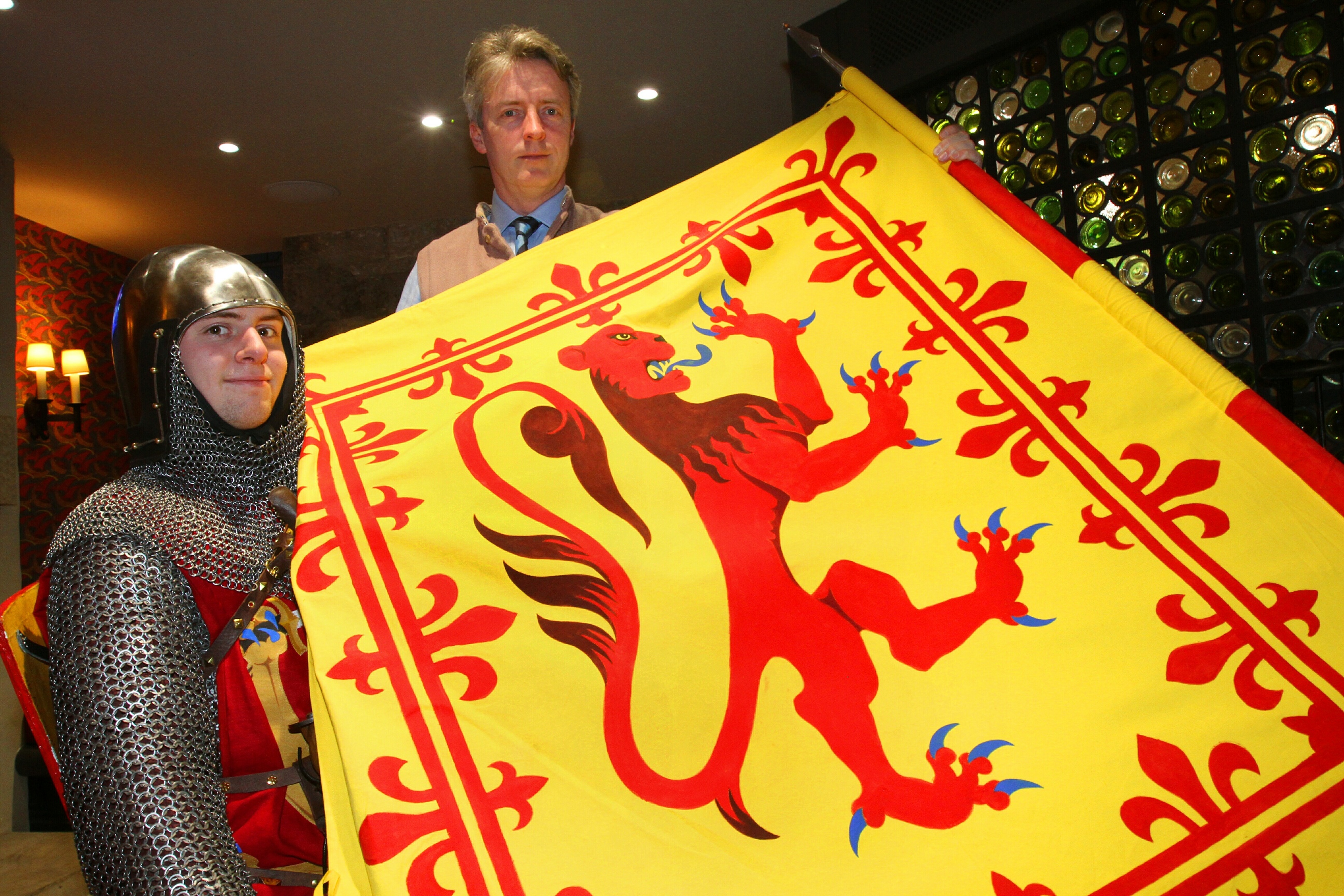 Maxwell Cutting and David Fox Pitt display the new coat of arms.