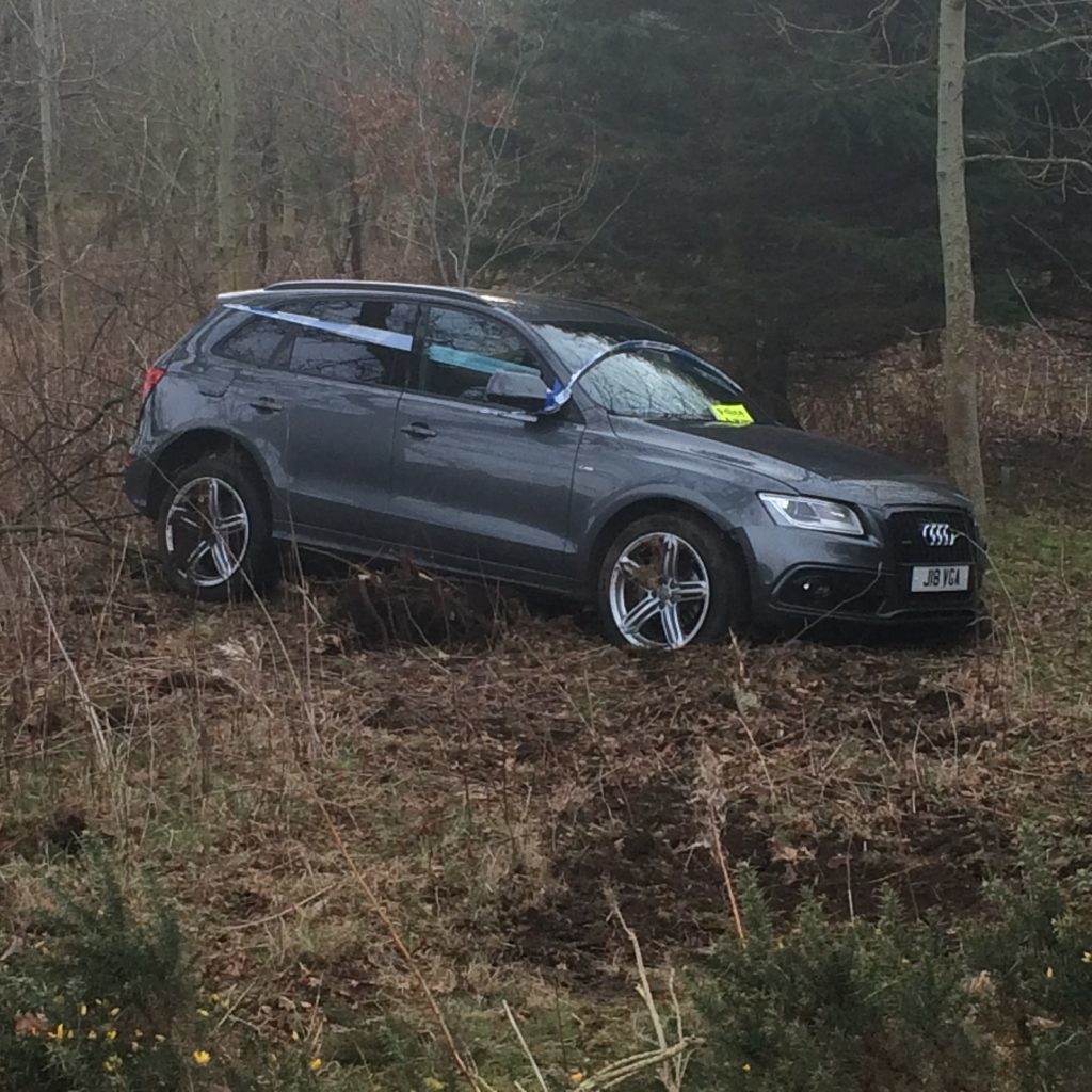 The Audi came to rest off the road