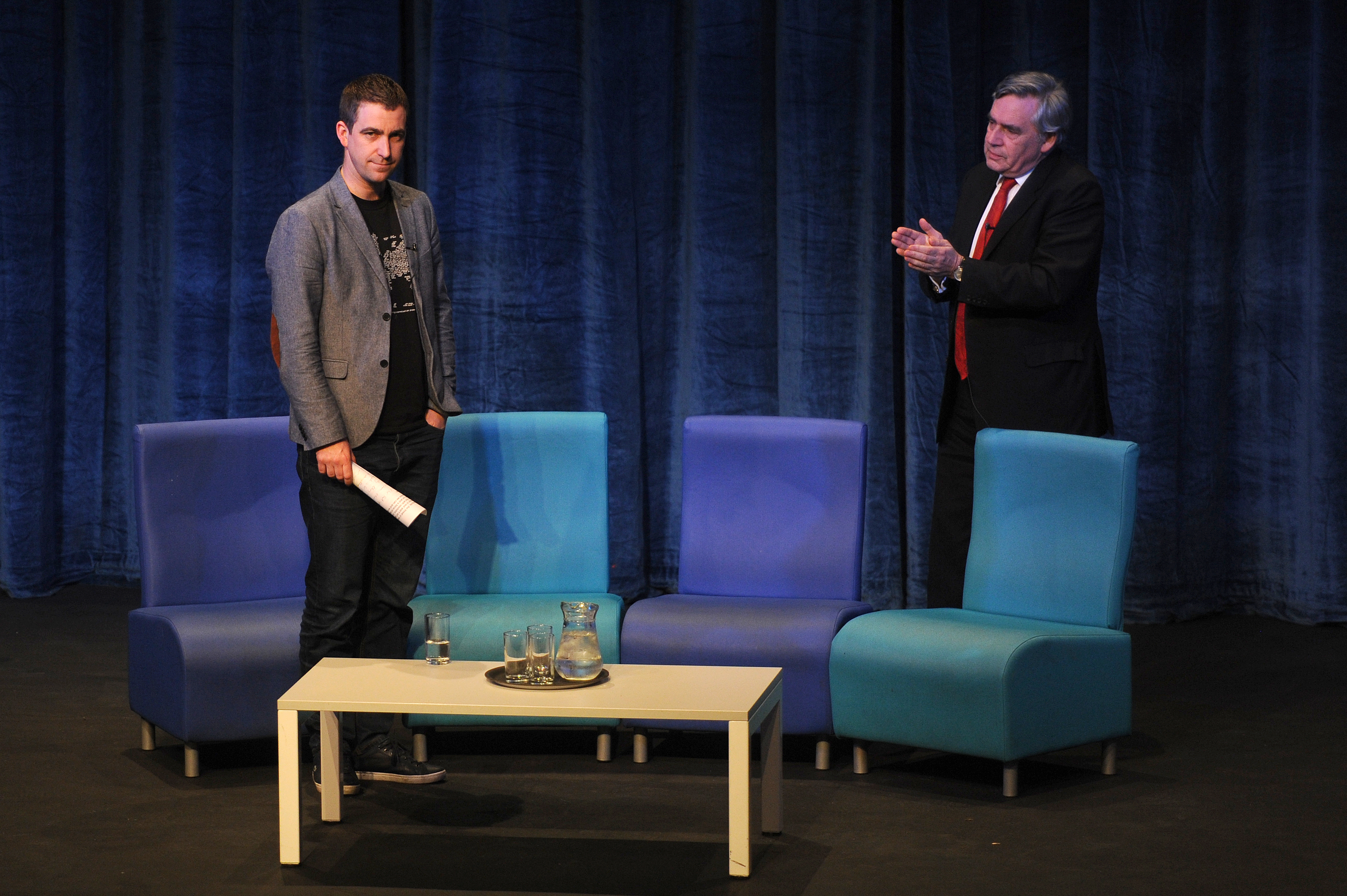 Brendan Cox on stage with Gordon Brown.