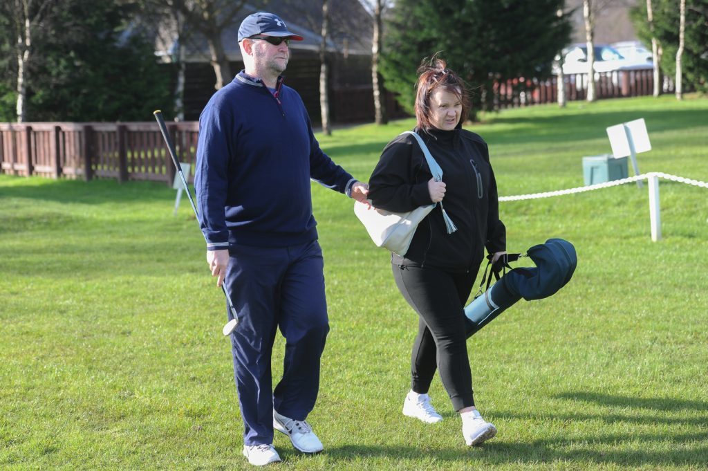 Blind golfer Jim Gales with his guide Shelly Cunningham. 