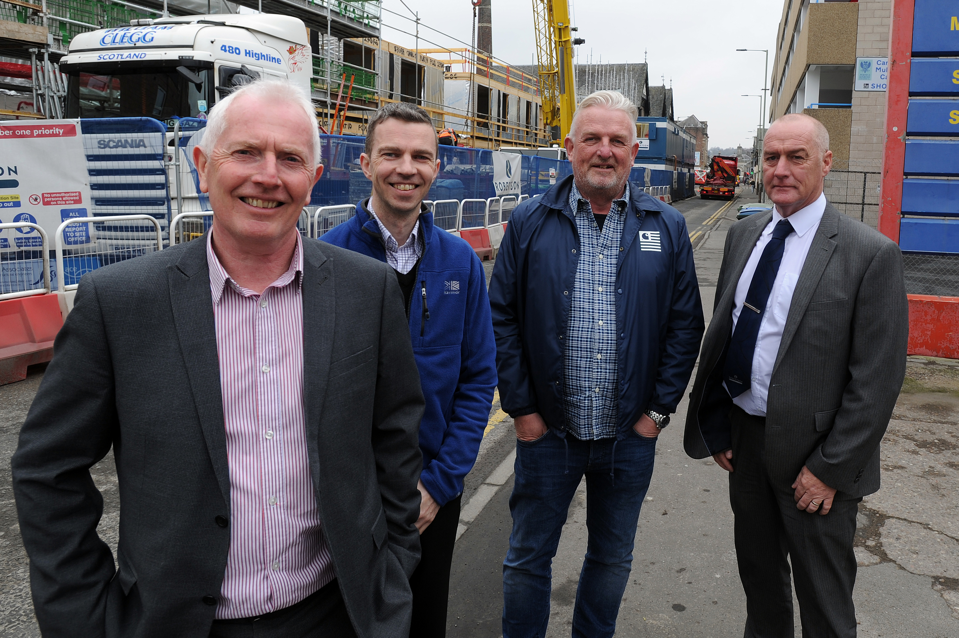 Work on the  housing development on Canal Street, Perth has re-started. From left,  Hamish Bell (quantity surveyor), Barry Lees (Fairfield Housing), Grant Ager (chief executive Fairfield Housing) and Richard Law (Robertson Partnership Homes).