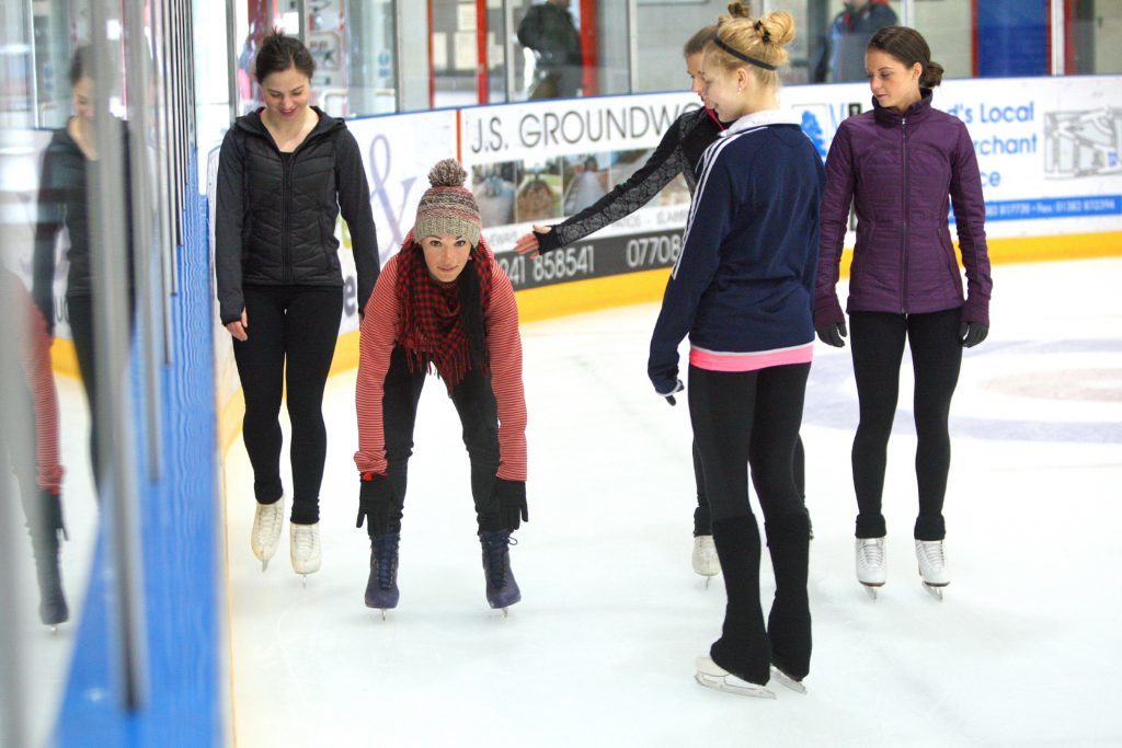 Gayle bends down to touch her toes!