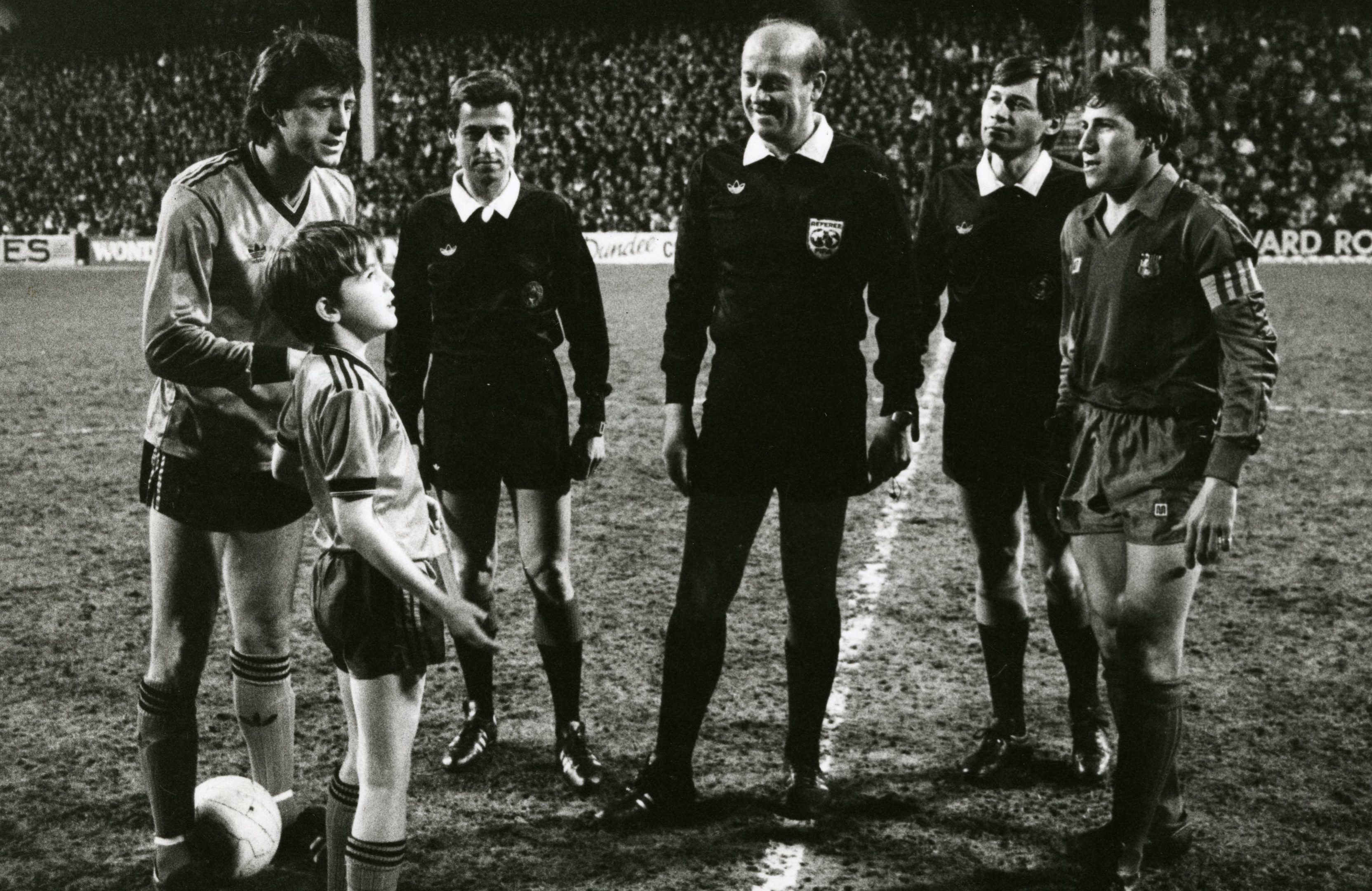 United Mascot at Barcelona Game.
Photograph showing the match officials with each teams captain as United mascot Scott Mitchell stands in awe. 4 March 1987.