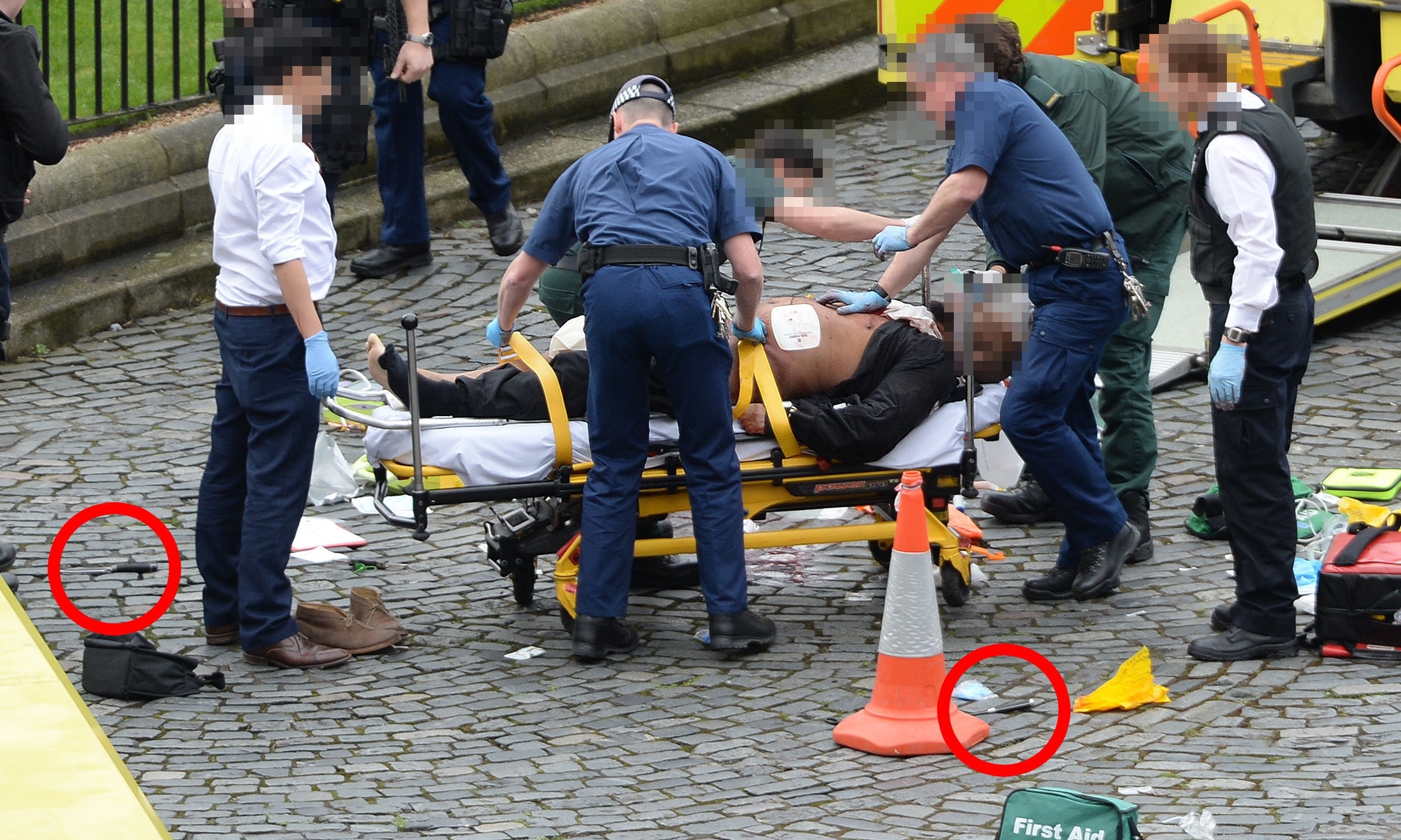 The suspected attacker, with knives highlighted on the ground.