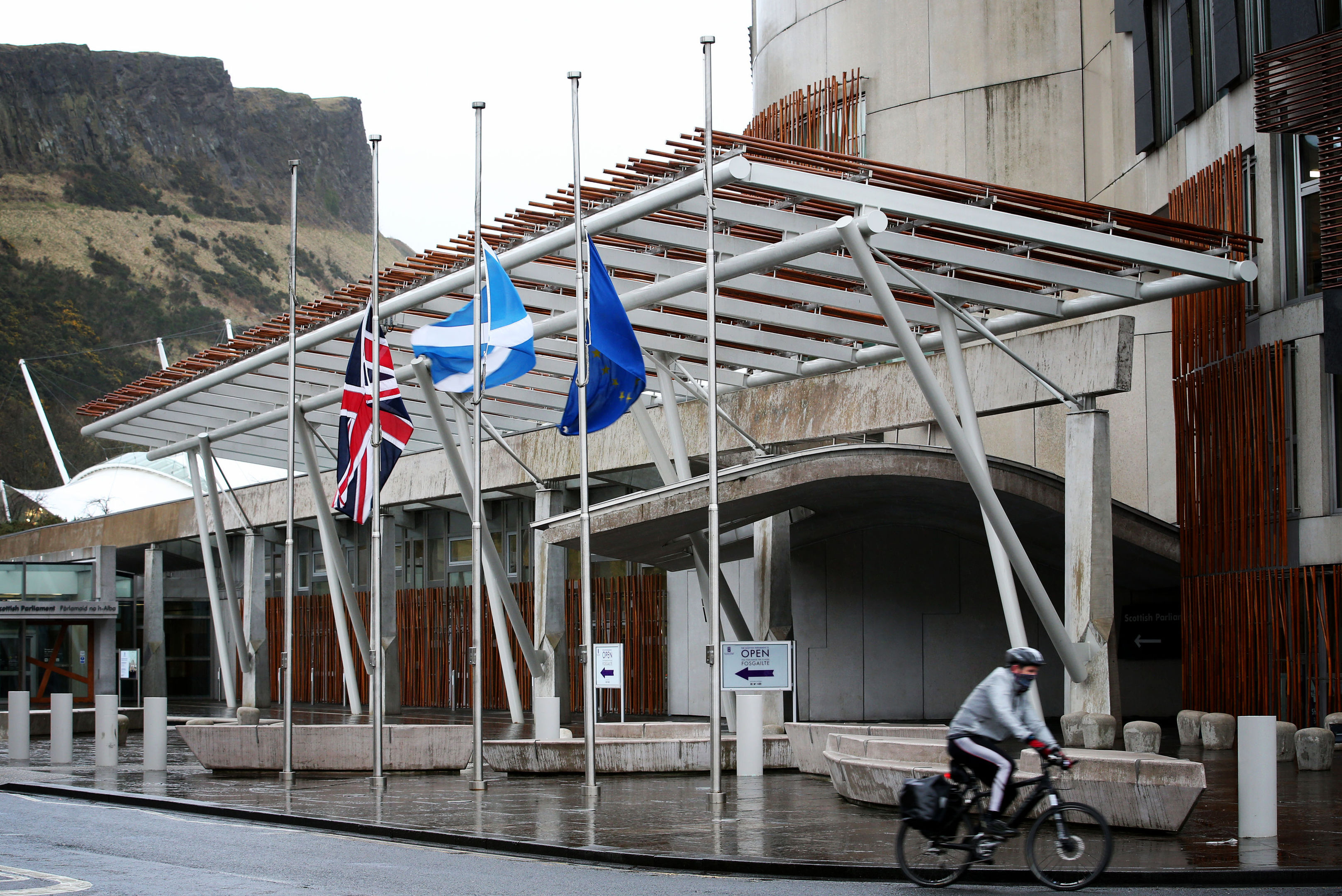 Flags fly at half-mast outside the Scottish Parliament.