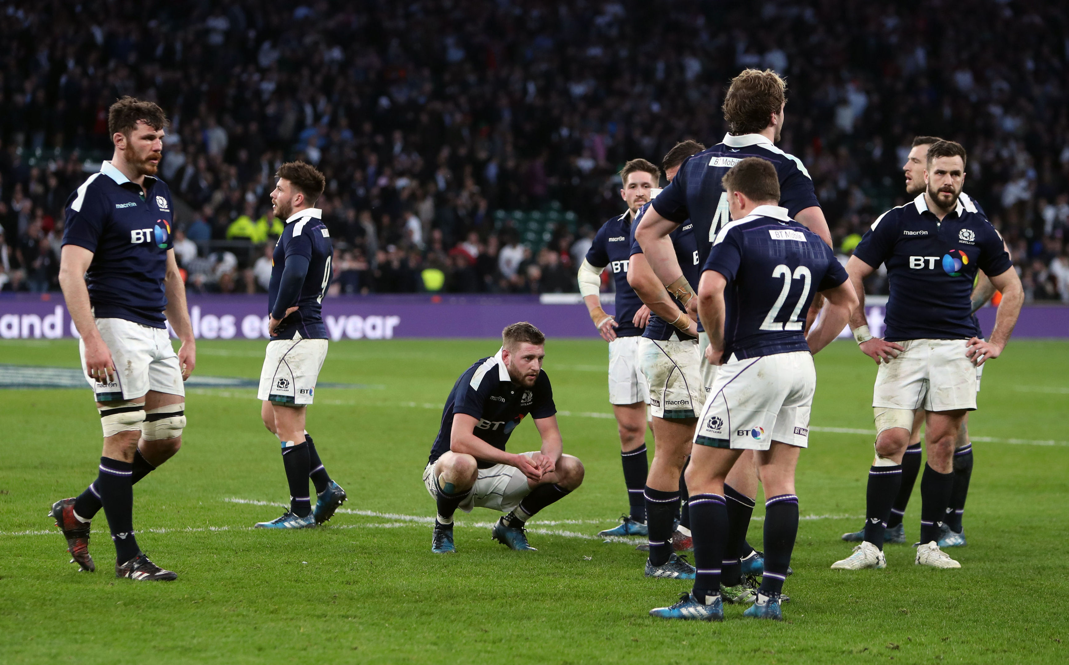 Dejected Scottish players at the end of Saturday's 61-21 defeat at Twickenham.