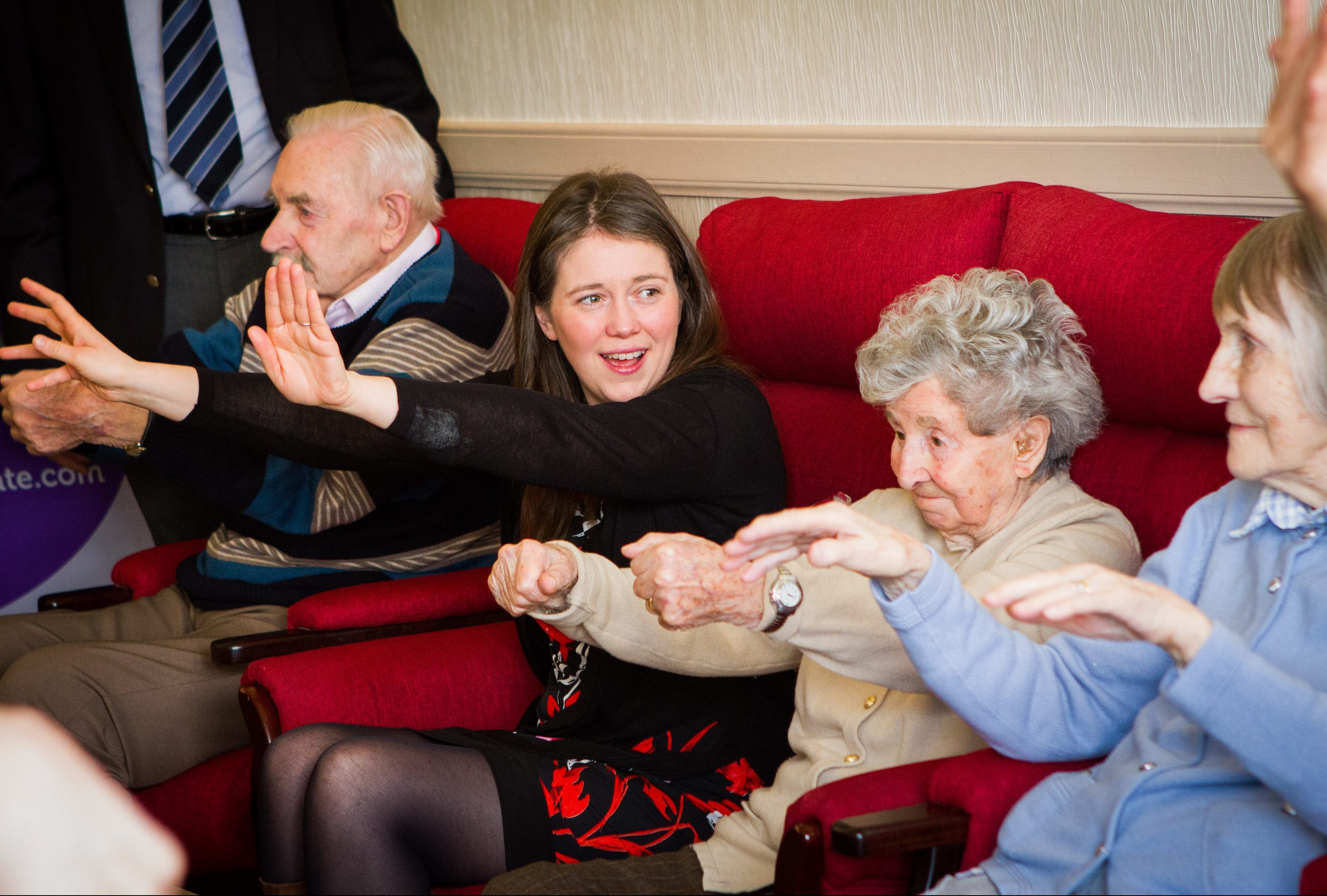 Aileen Campbell alongside residents, left to right, Ian Whitton, Dorothy Bell and Betty Hillis, during the morning workout routine.