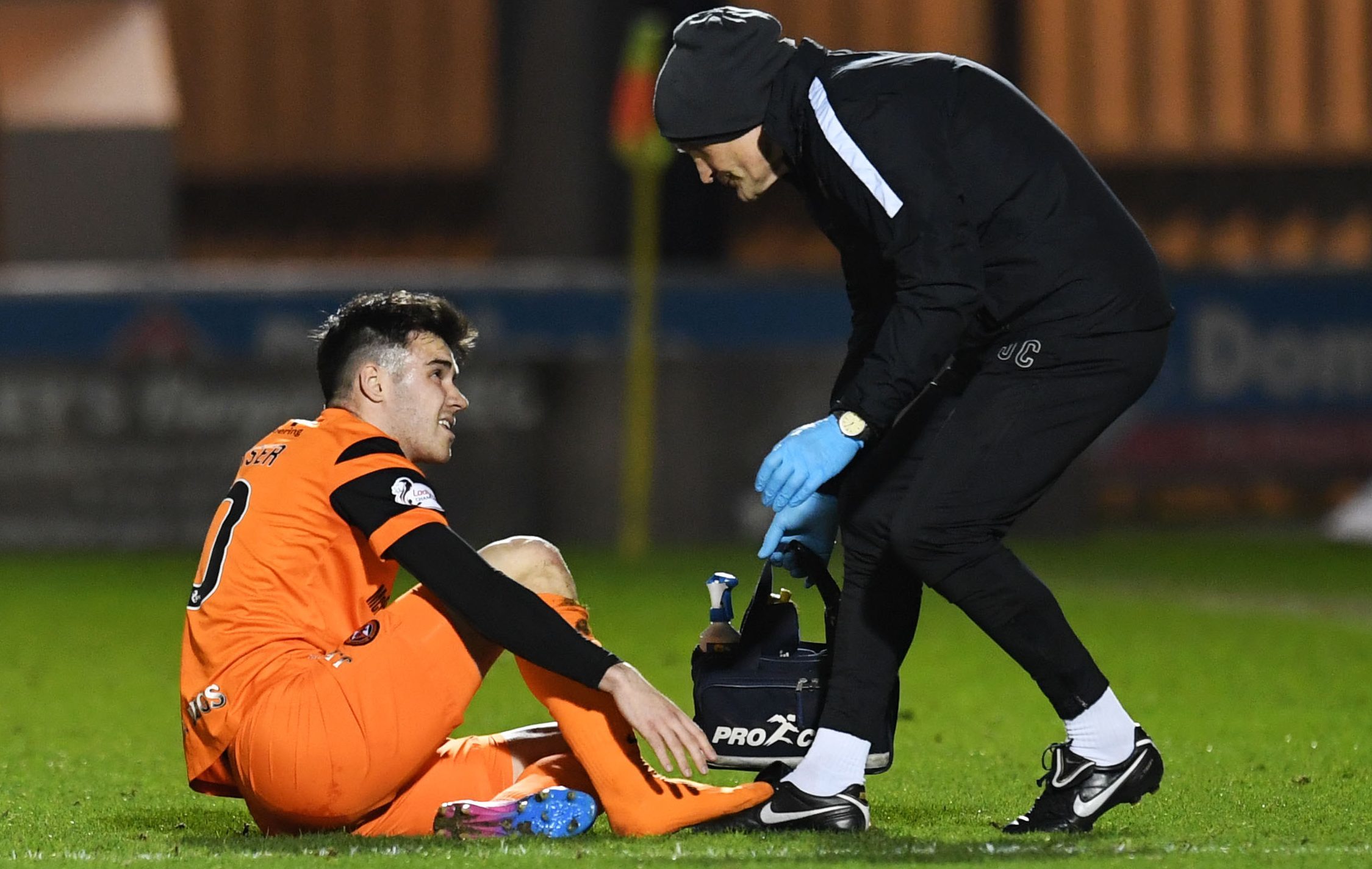Scott Fraser receiving treatment from the club physio.