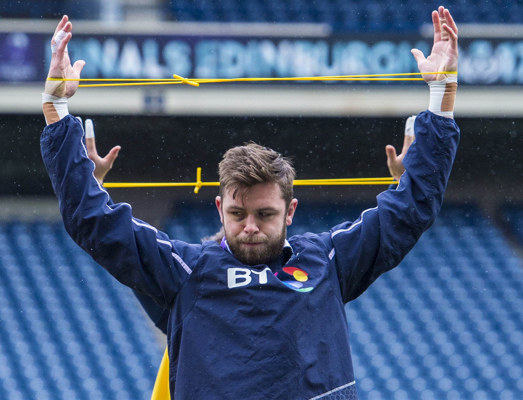 Ryan Wilson does stretching exercises at the Scotland captain's run at BT Murrayfield.