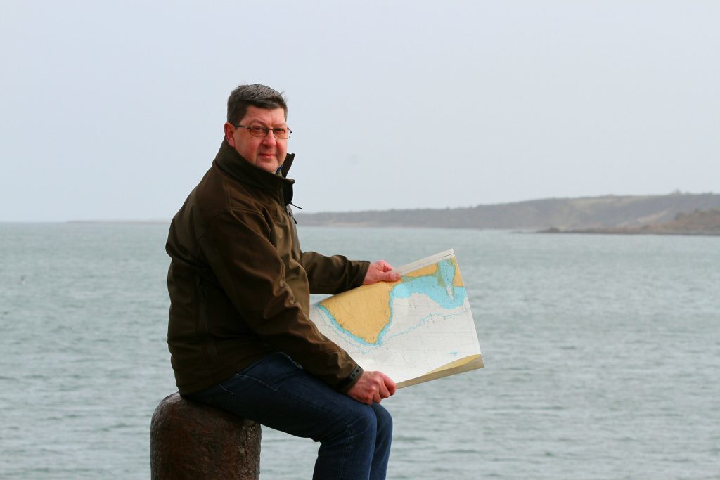 Maritime archaeologist Neil Dobson from St Andrews looking out into St Andrews Bay from the pier