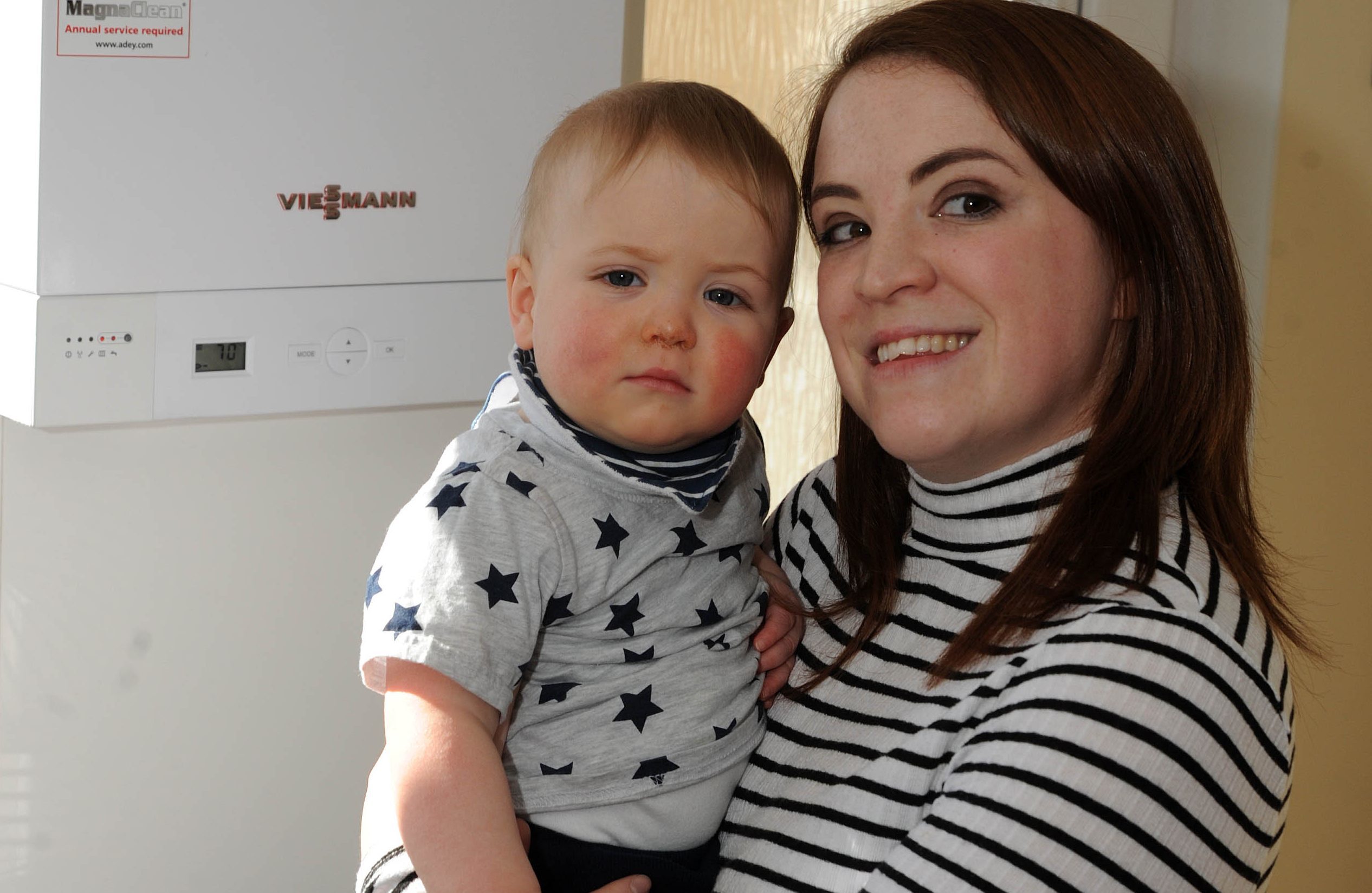 Sarah Cook with son Zac and her new boiler.
