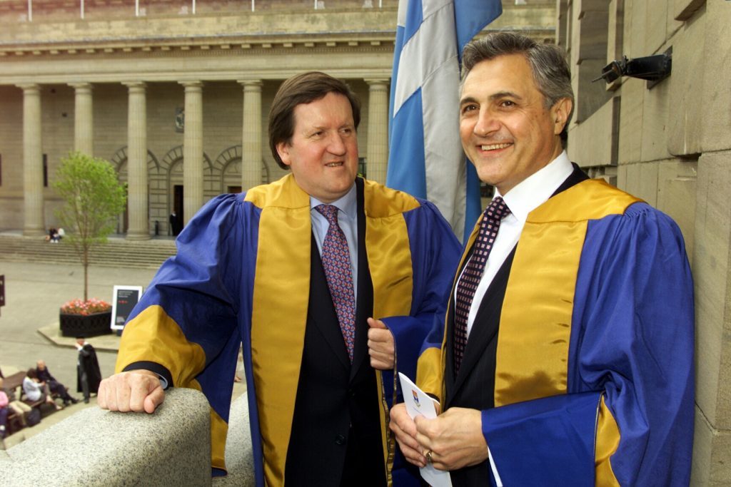 John Suchet received an honorary degree from Dundee University alongside George Robertson in 2000 