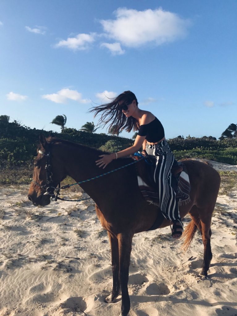 Lisa Haynes on a beach trek with Tosh the horse on Cove Bay Beach, Anguilla. 