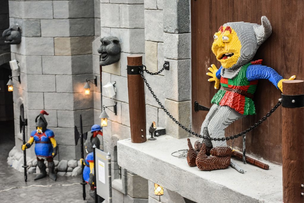 Photo of a lego model in front of the Kingdoms entrance gate. 