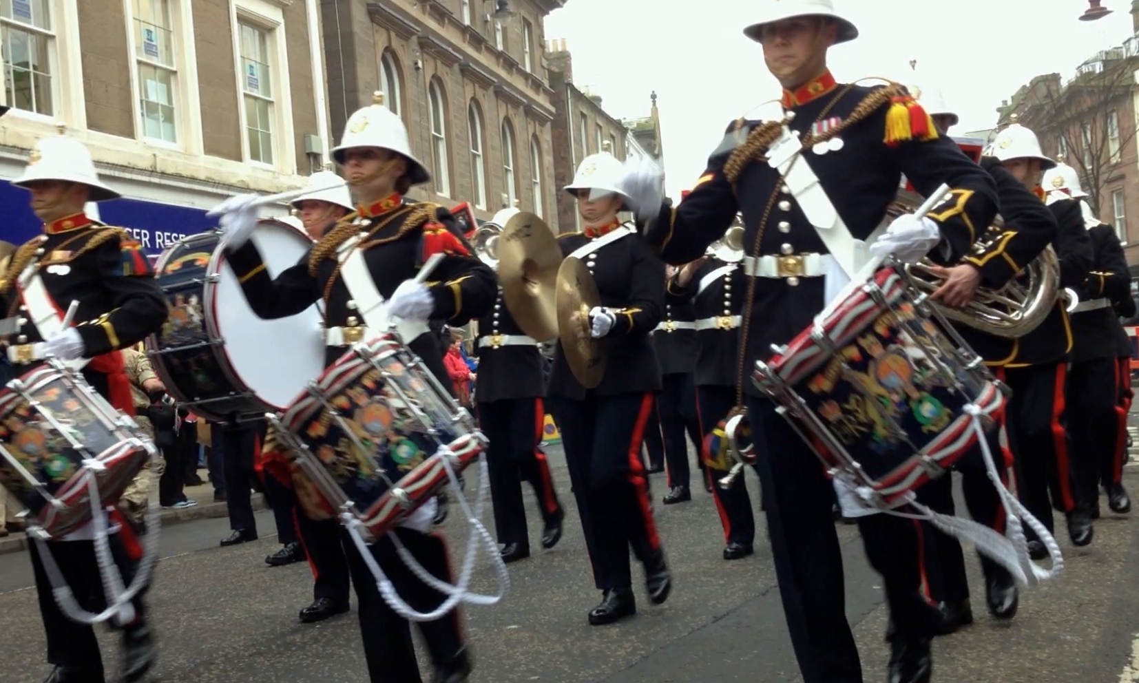 The marines parade through the High Street.