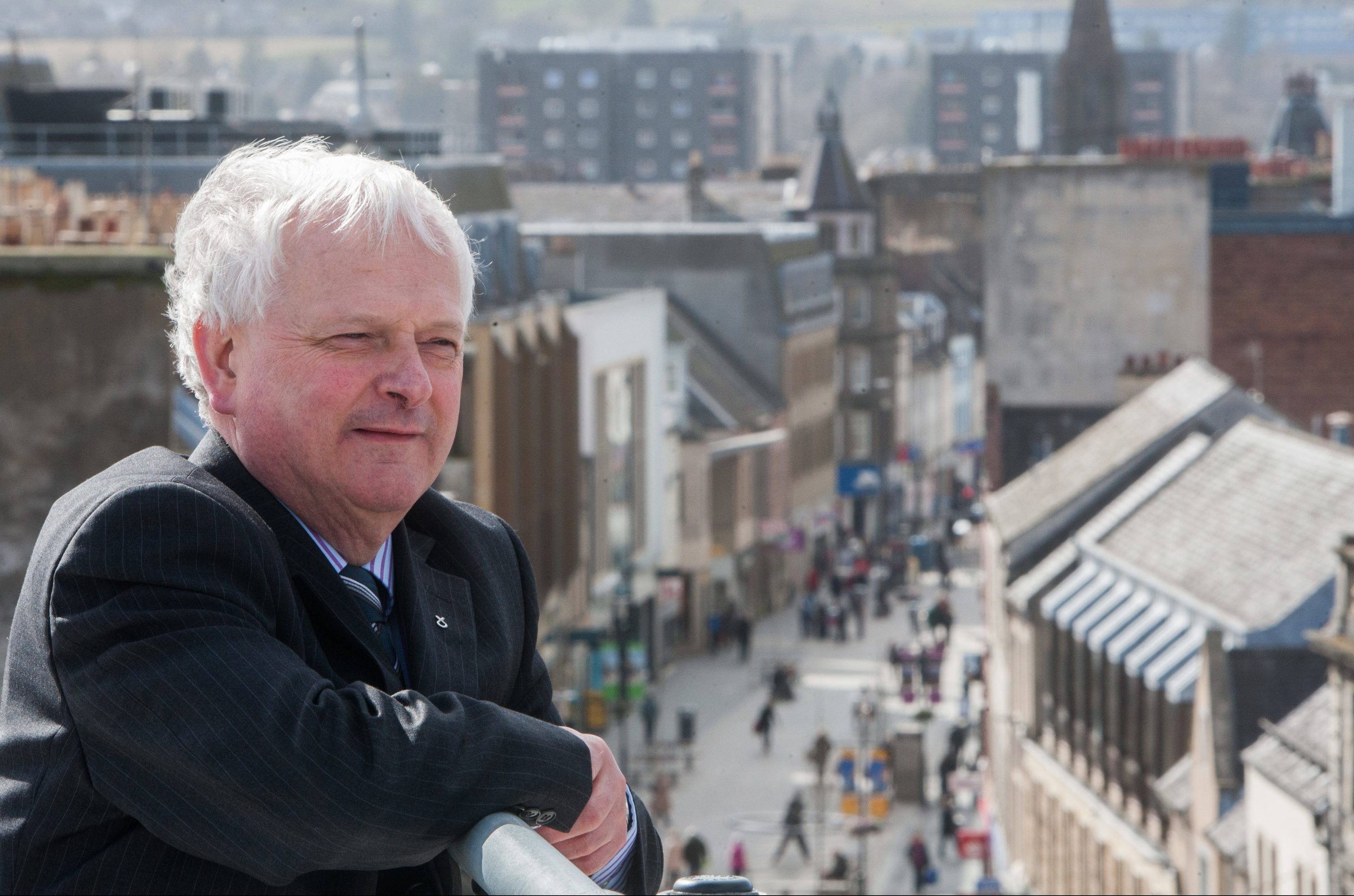 Councillor Ian  Miller with Perth High Street in the background.