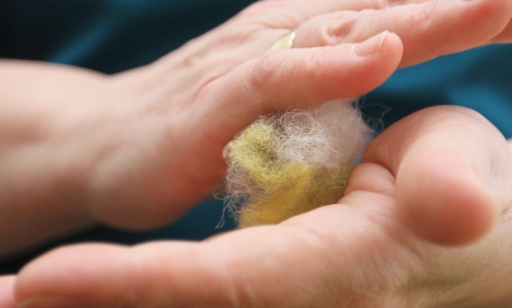 Julie upcycles home-produced fleece to create innovative wool fibre pillows.