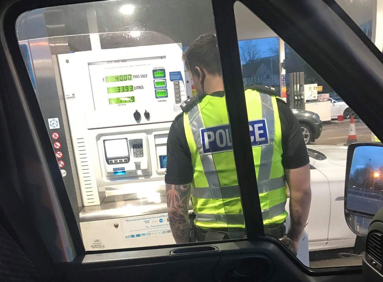 Police inspecting the pay at pump machine in Dunfermline.