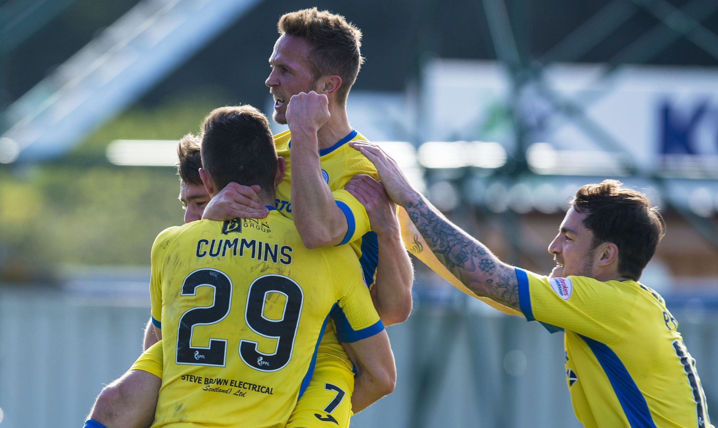 Graham Cummins celebrates his goal with his team-mates.