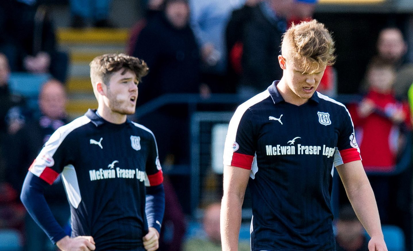 Dejected Dundee players at full-time.