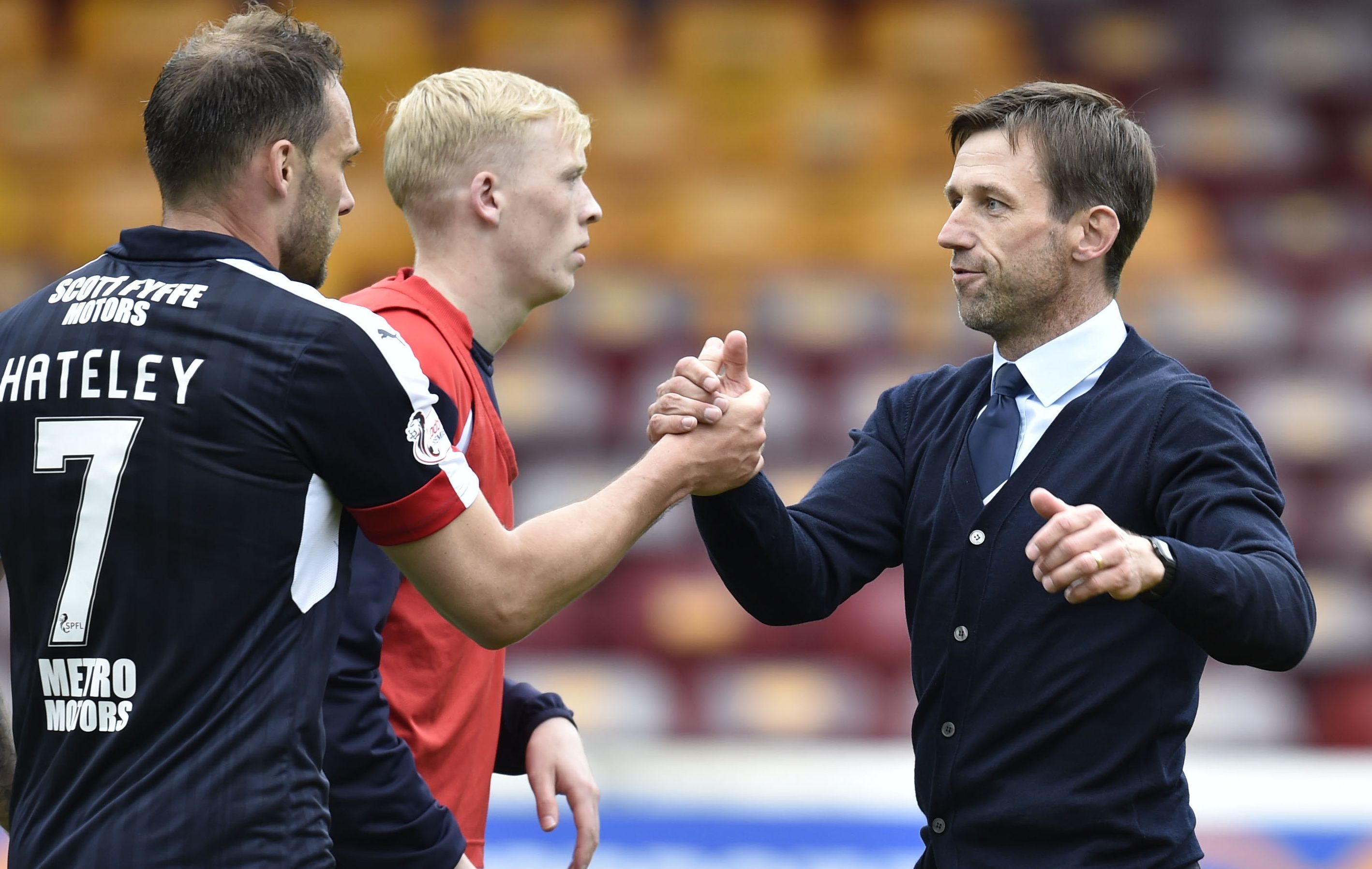 Dundee interim manager Neil McCann celebrates at full time with Tom Hateley.