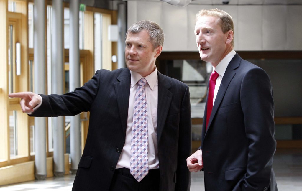 Tavish Scott MSP talks with Willie Rennie at the Scottish Parliament.