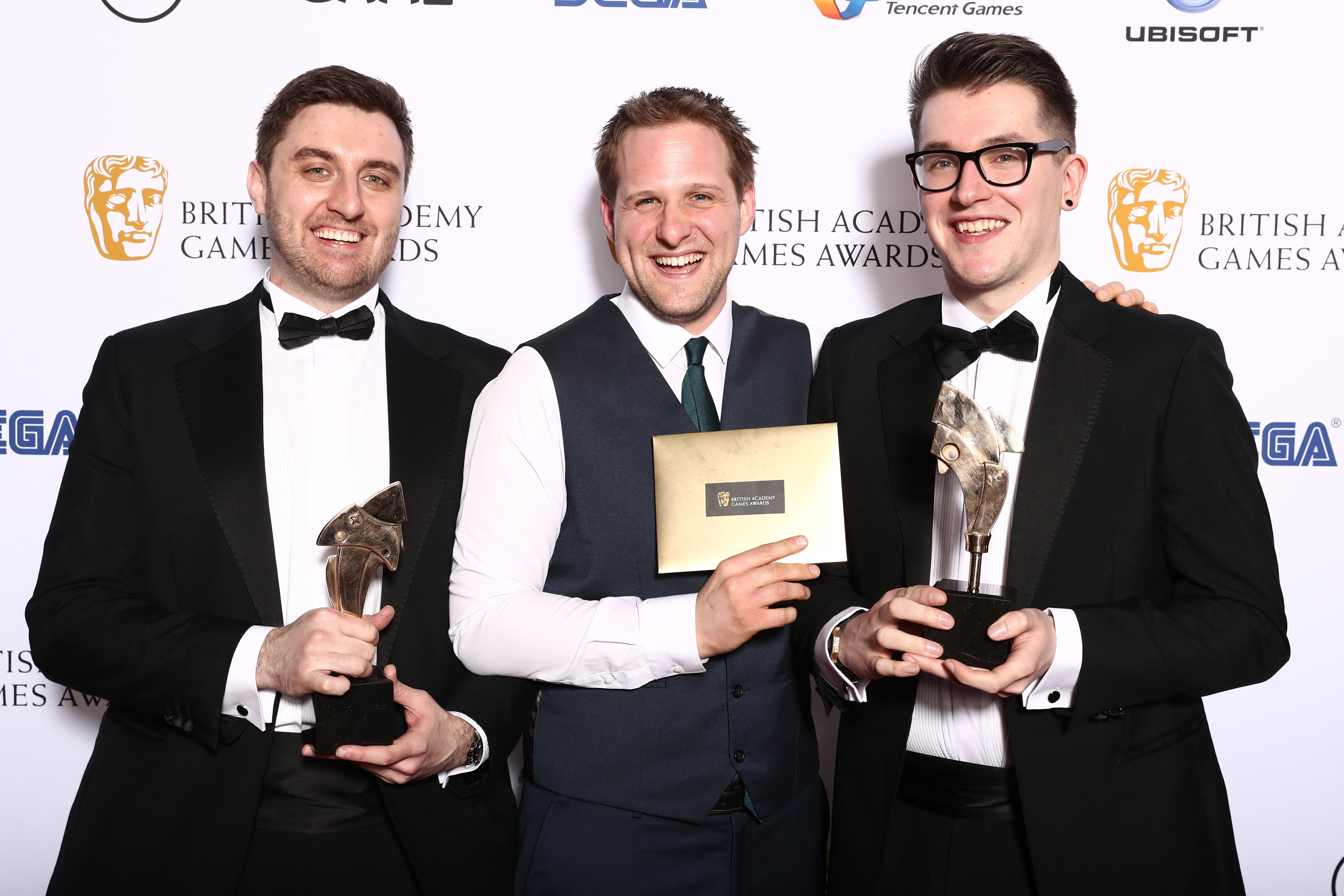 The Bluedoor Games team (L-R) Lukasz Gomula, Ashton Mills and Roberto Macken, celebrate their BAFTA win.