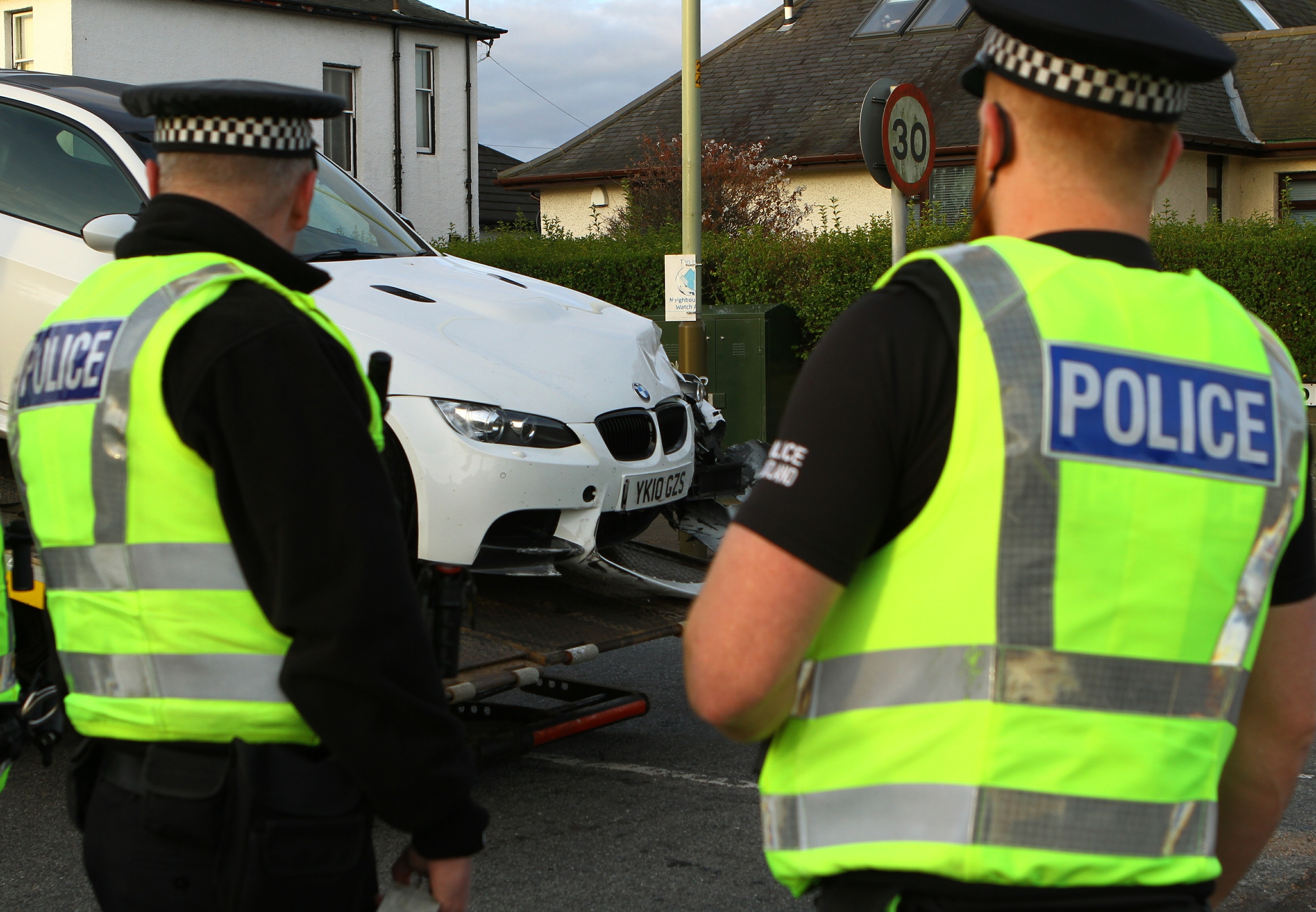 The BMW being taken away from the crash scene.