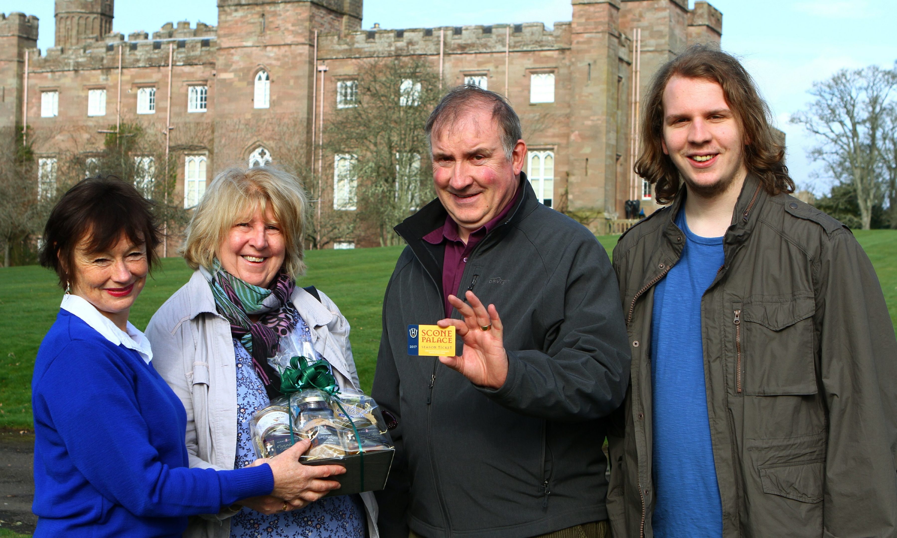 First visitors to Scone Palace at the start of the new season. Margaret and John Panton, with their son Murray, from Perth, receiving their Season Ticket, and a hamper from Ticket Assistant Lynne Aitken.