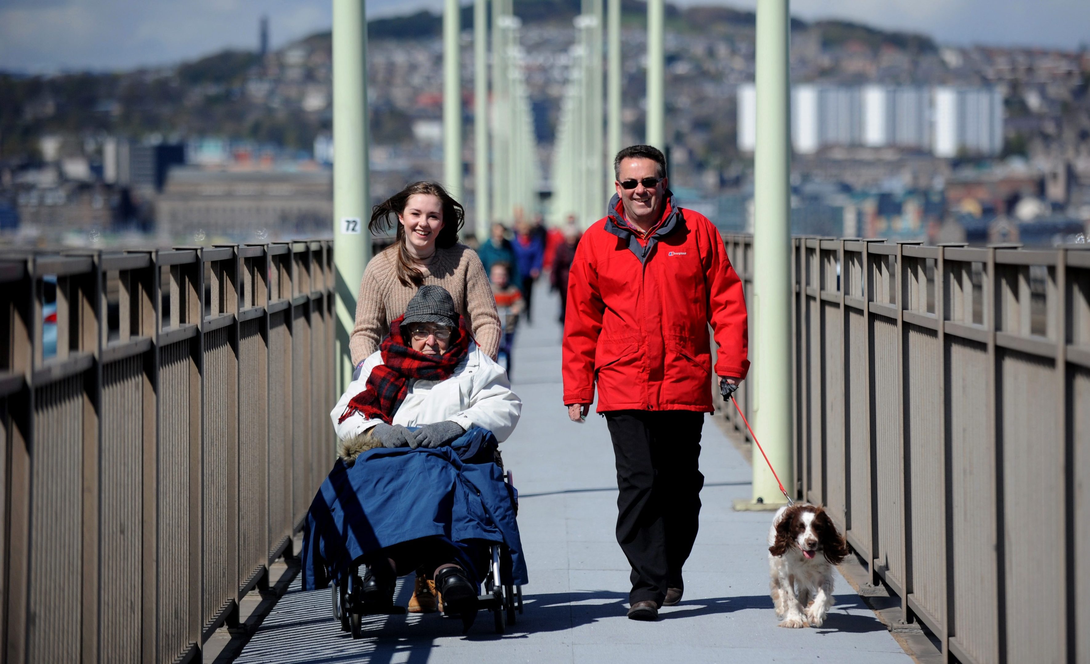 Douglas Tucker taking part with his grand daughter Annie and son Peter in last years Christian Aid Tay Bridge walk.