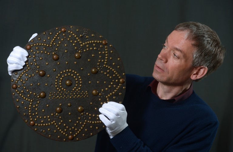 Hugh Morrison, collections registrar at Historic Environment Scotland, packing the 18th Century targe from Arbroath Abbey before it travelled to China