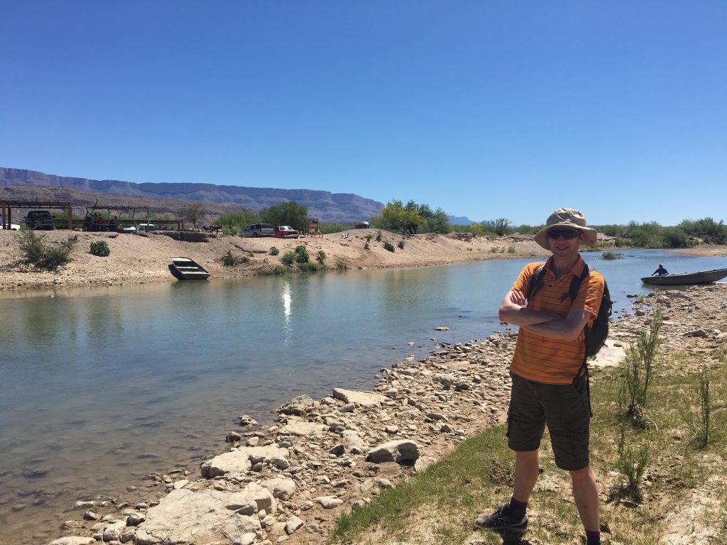 Michael Alexander on the US side of the Rio Grande River which is shallow enough to wade. On the other side lies Mexico - and there is no wall!