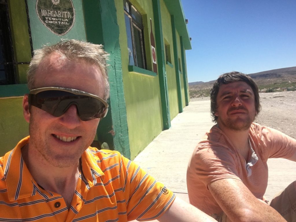 Michael Alexander (left) and ex-Courier reporter Bryan Kay - who also made the road trip - enjoying an ice cold beer in Boquillas del Carmen after crossing the Mexican border from Texas