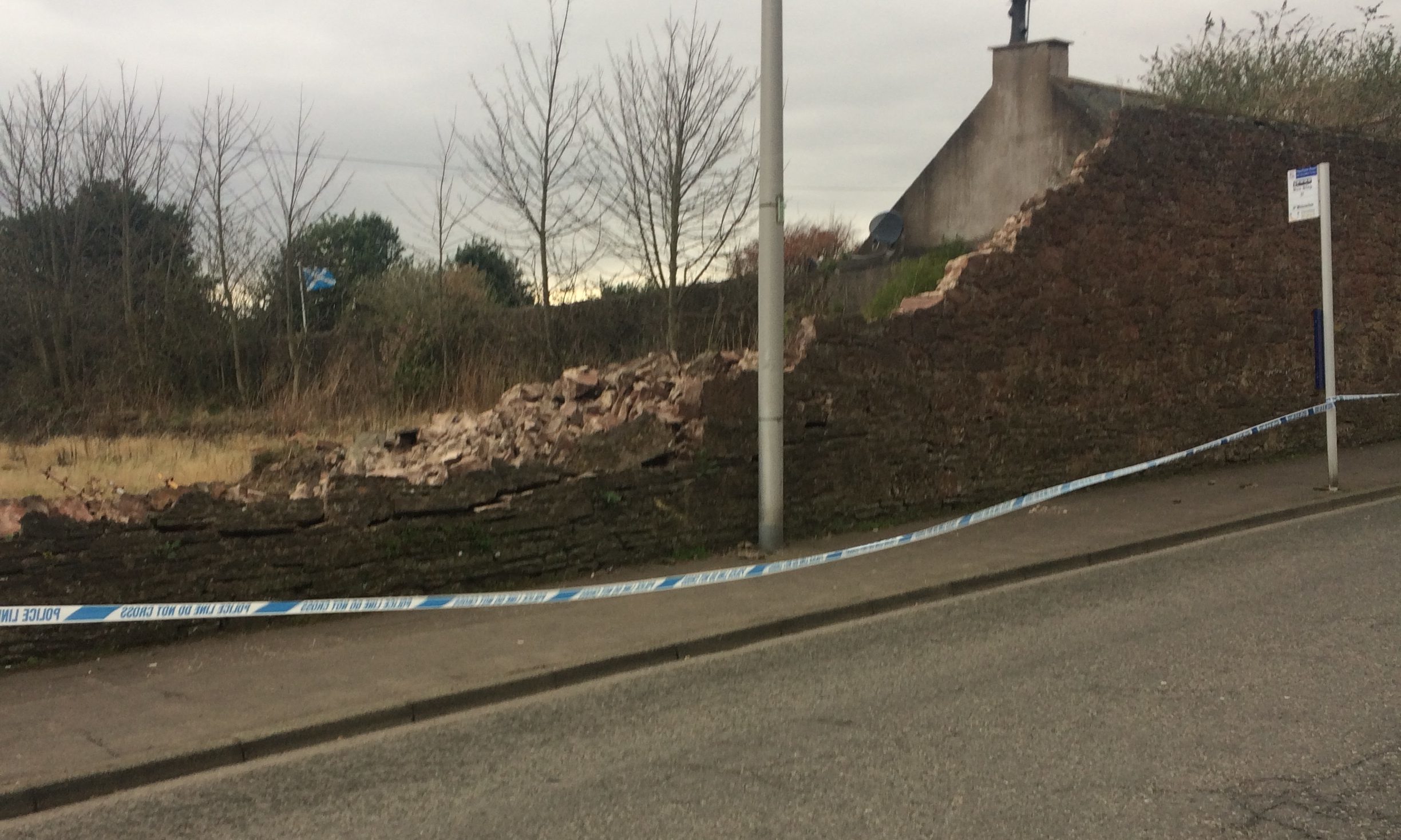 The collapsed wall on Hayshead Road.