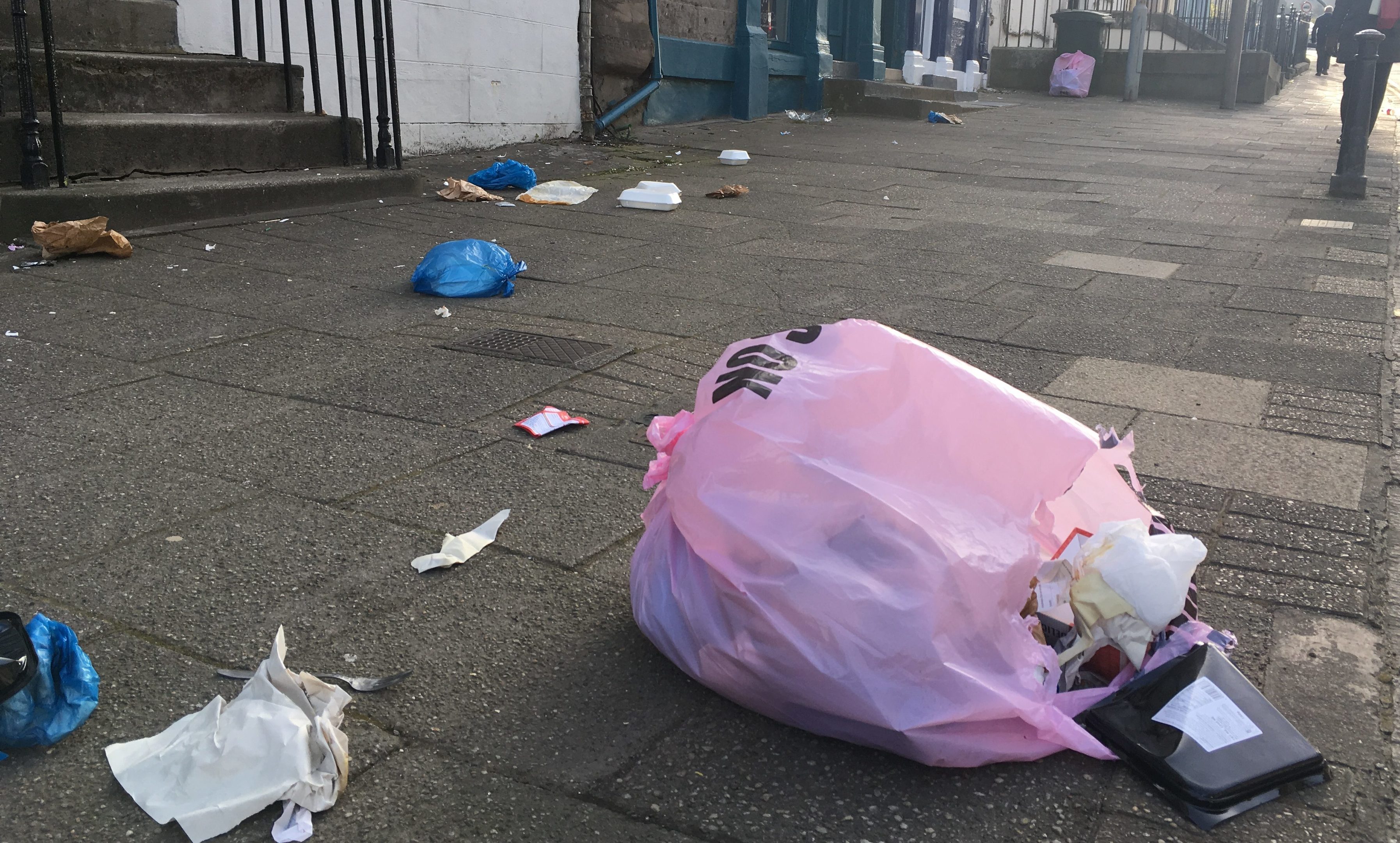 Rubbish strewn across Charlotte Street, Perth.