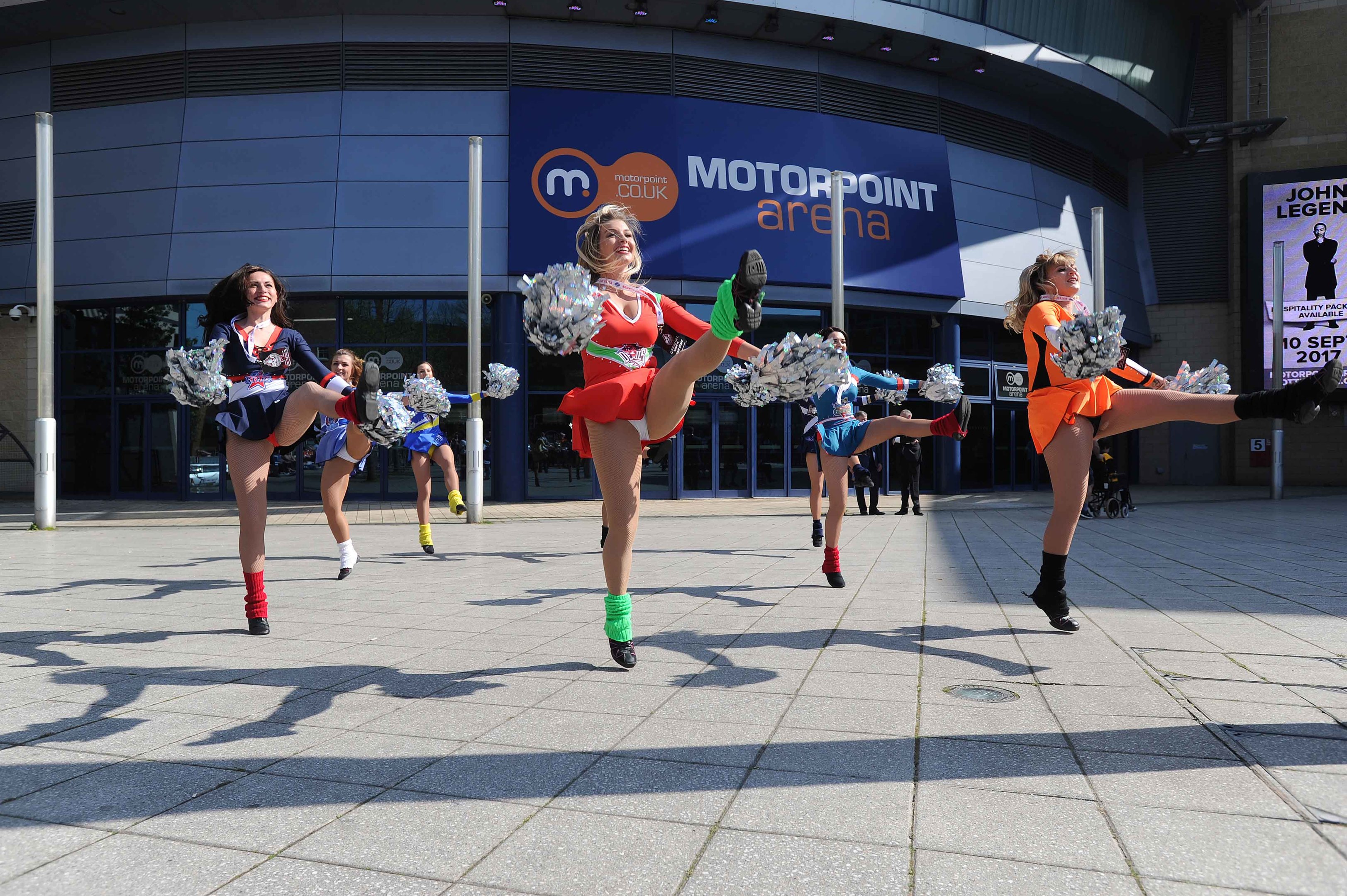 Cheer leaders greet fans arriving at the Motorpoint Arena.