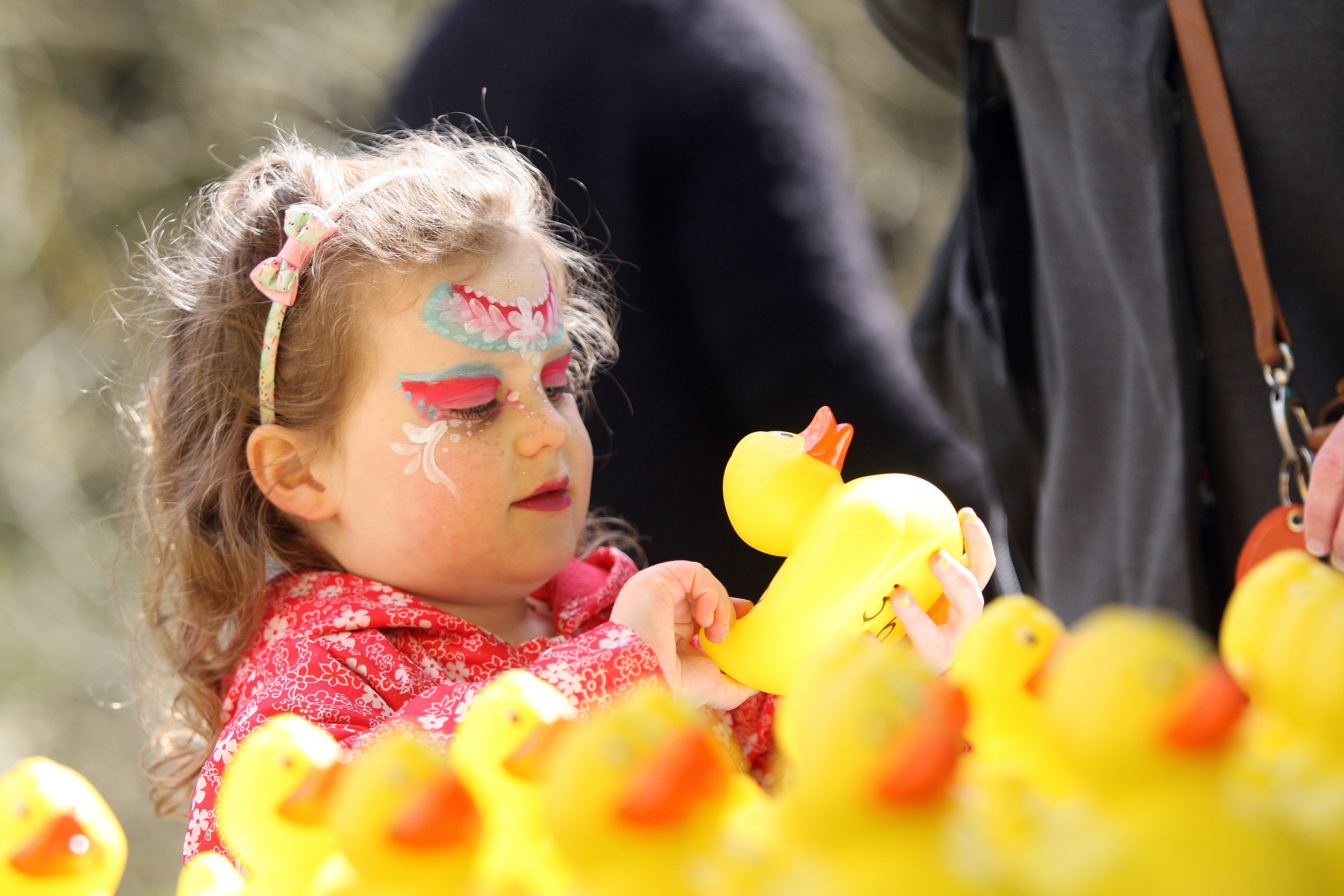 Erin Durcan carefully selecting her duck at 
Barry Mill Easter Duck race and fun day