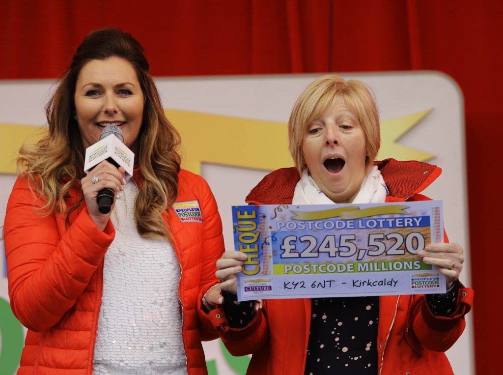 Lorraine Reilly is shell-shocked on stage with host Judie McCourt.