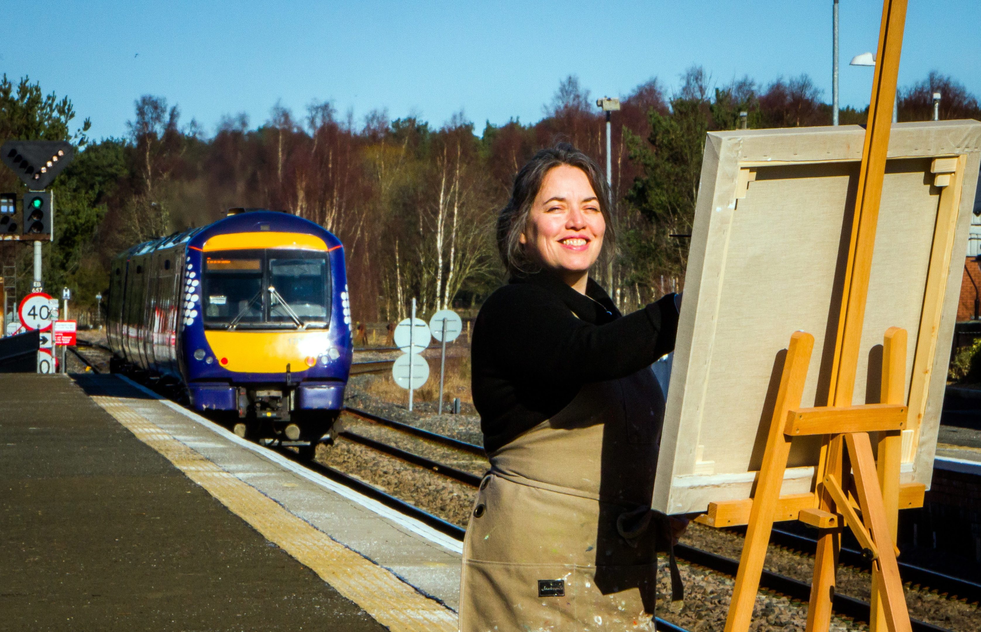 Kirsty Lorenz painting in 2016 at Ladybank Station where she has a studio