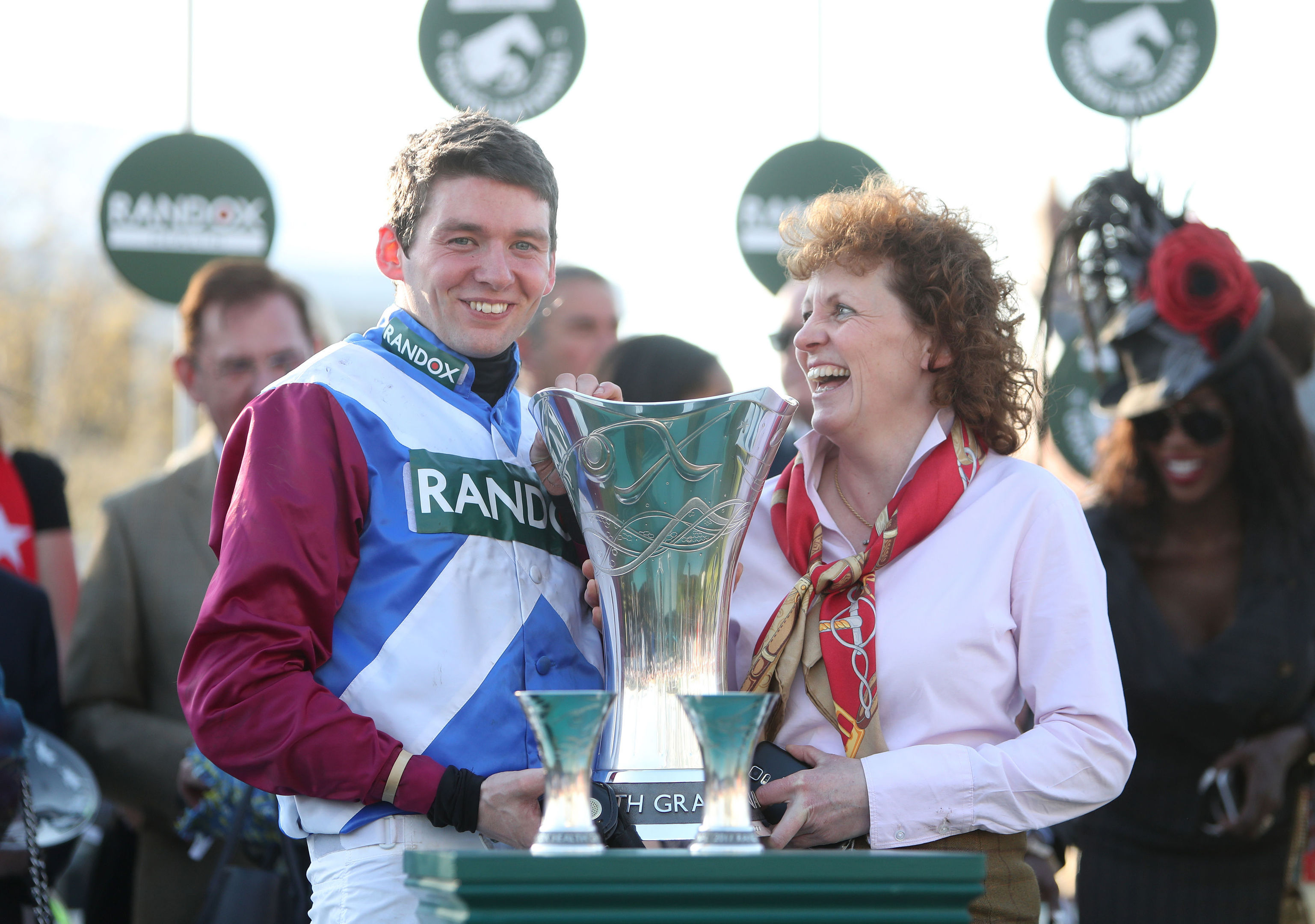 Jockey Derek Fox and trainer Lucinda Russell celebrate with the trophy after winning the Randox Health Grand National on One For Arthur.