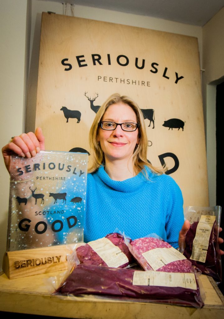 Vikki proudly displays some venison products.