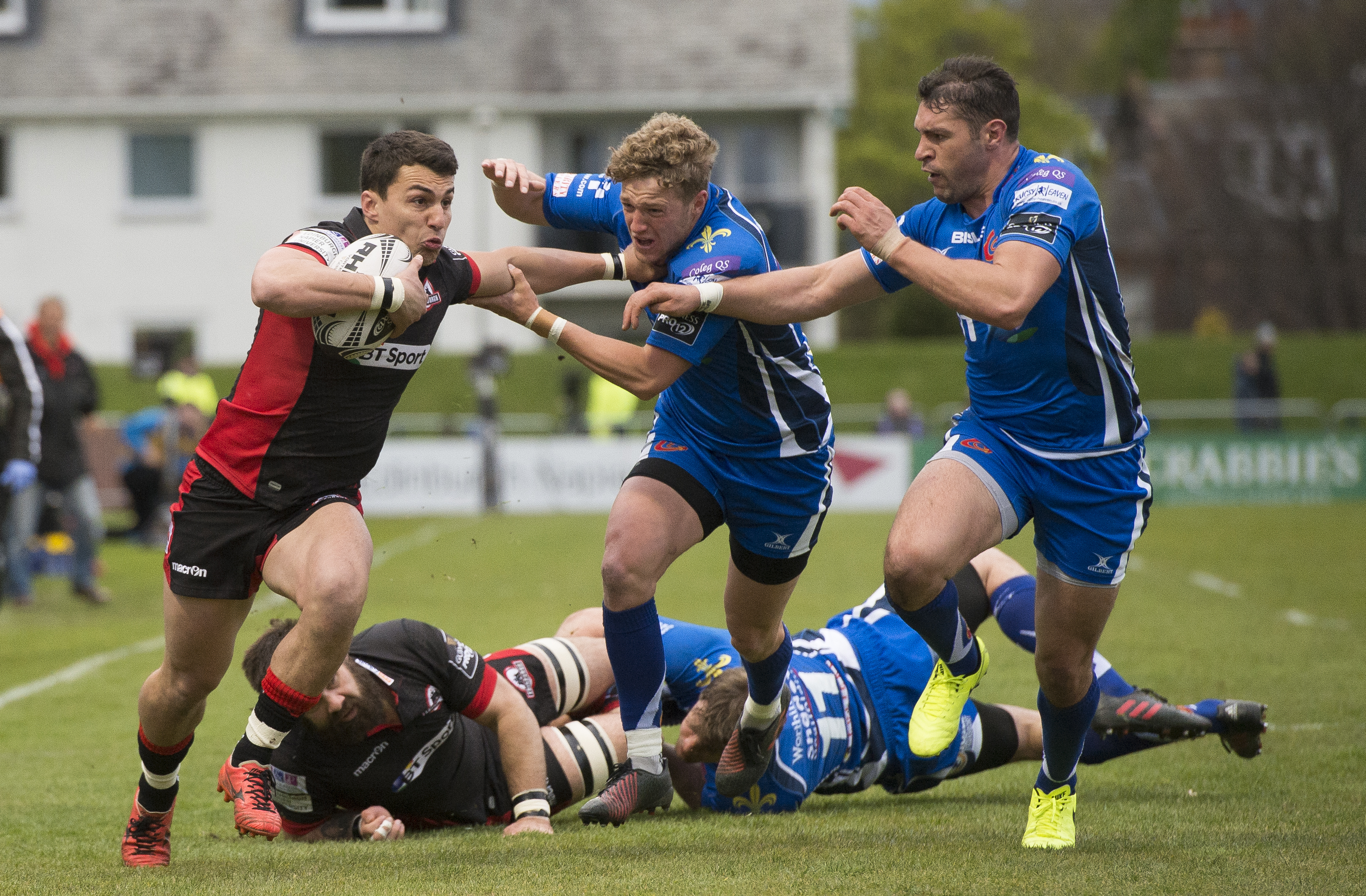 Edinburgh's Damien Hoyland holds off  a Dragons challenge in last night's PRO12 match at Myreside.