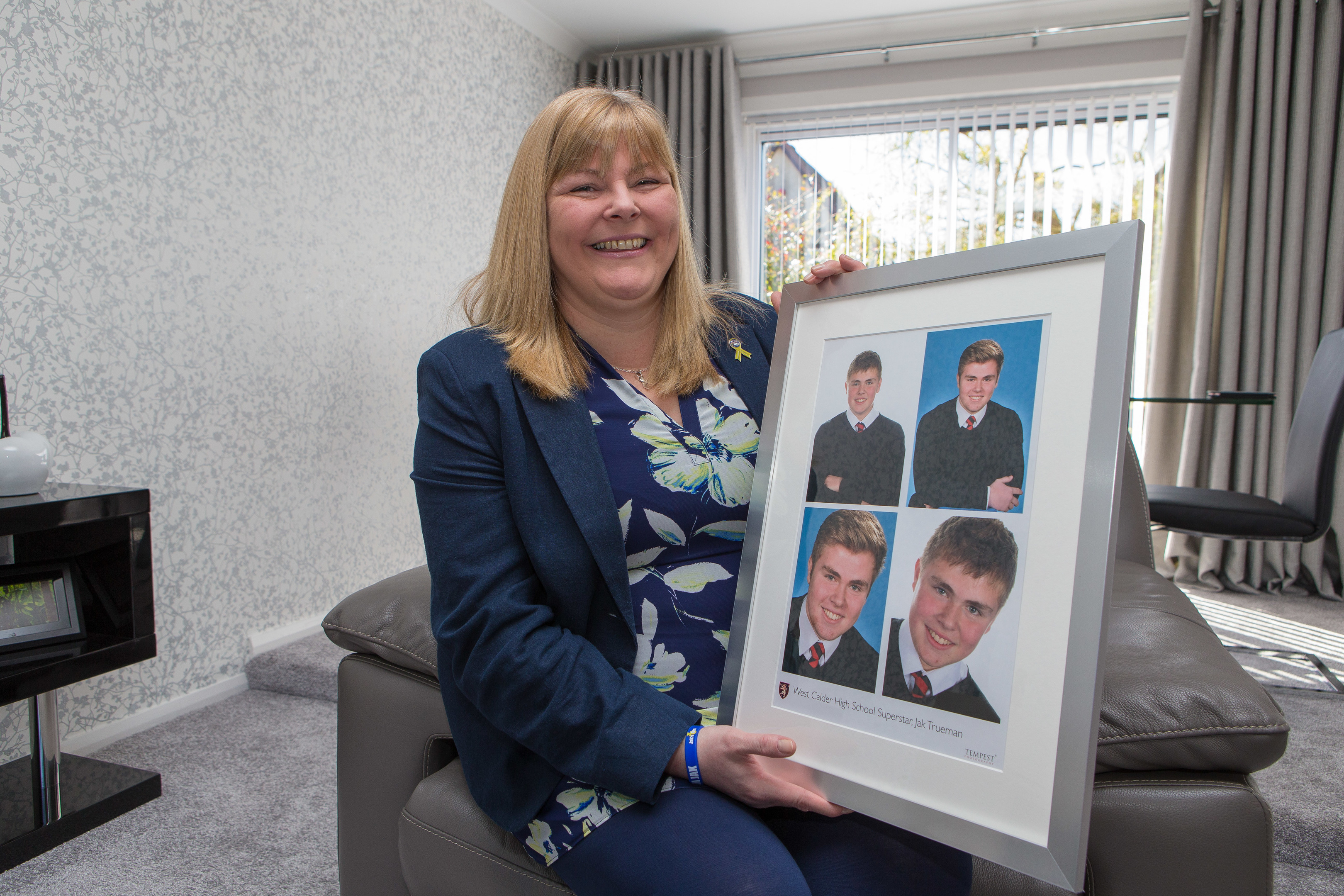 Allison Barr with a picture of Jak.