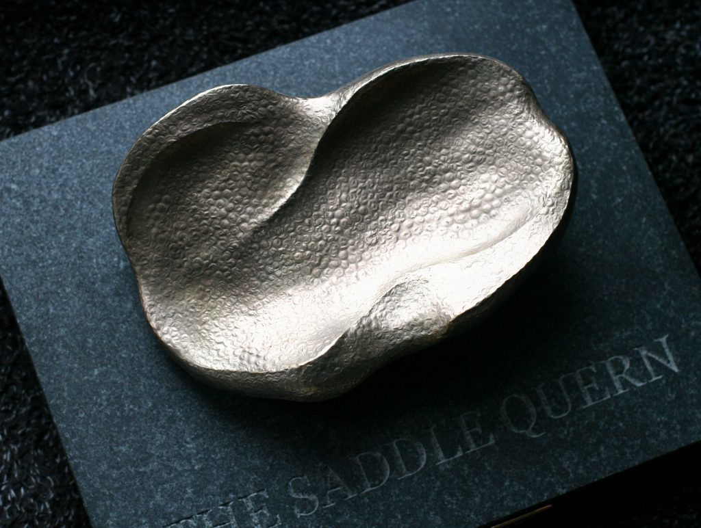 The unusual Saddle Quern trophy.